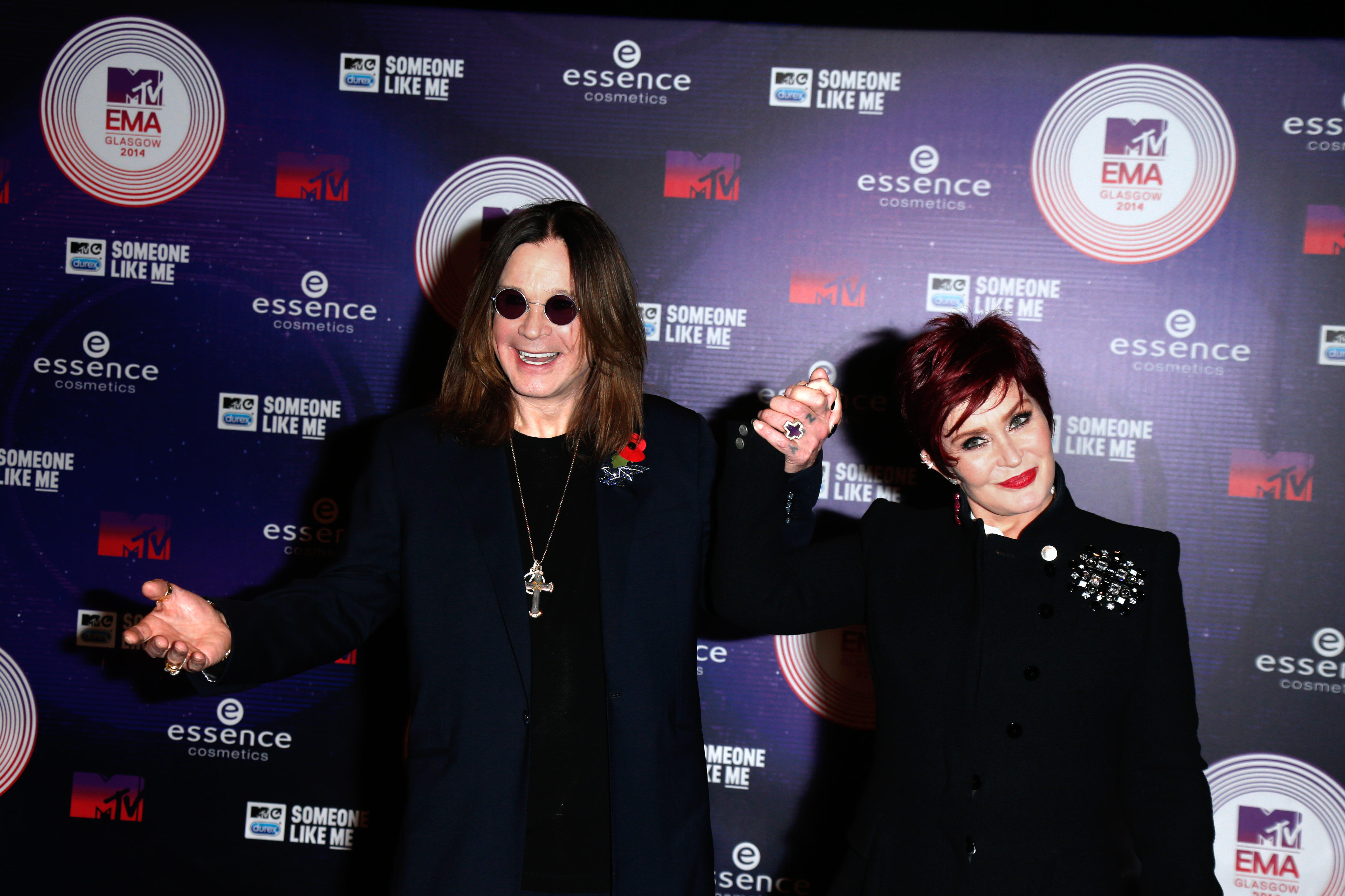 Ozzy and Sharon Osbourne with their hands held up together
