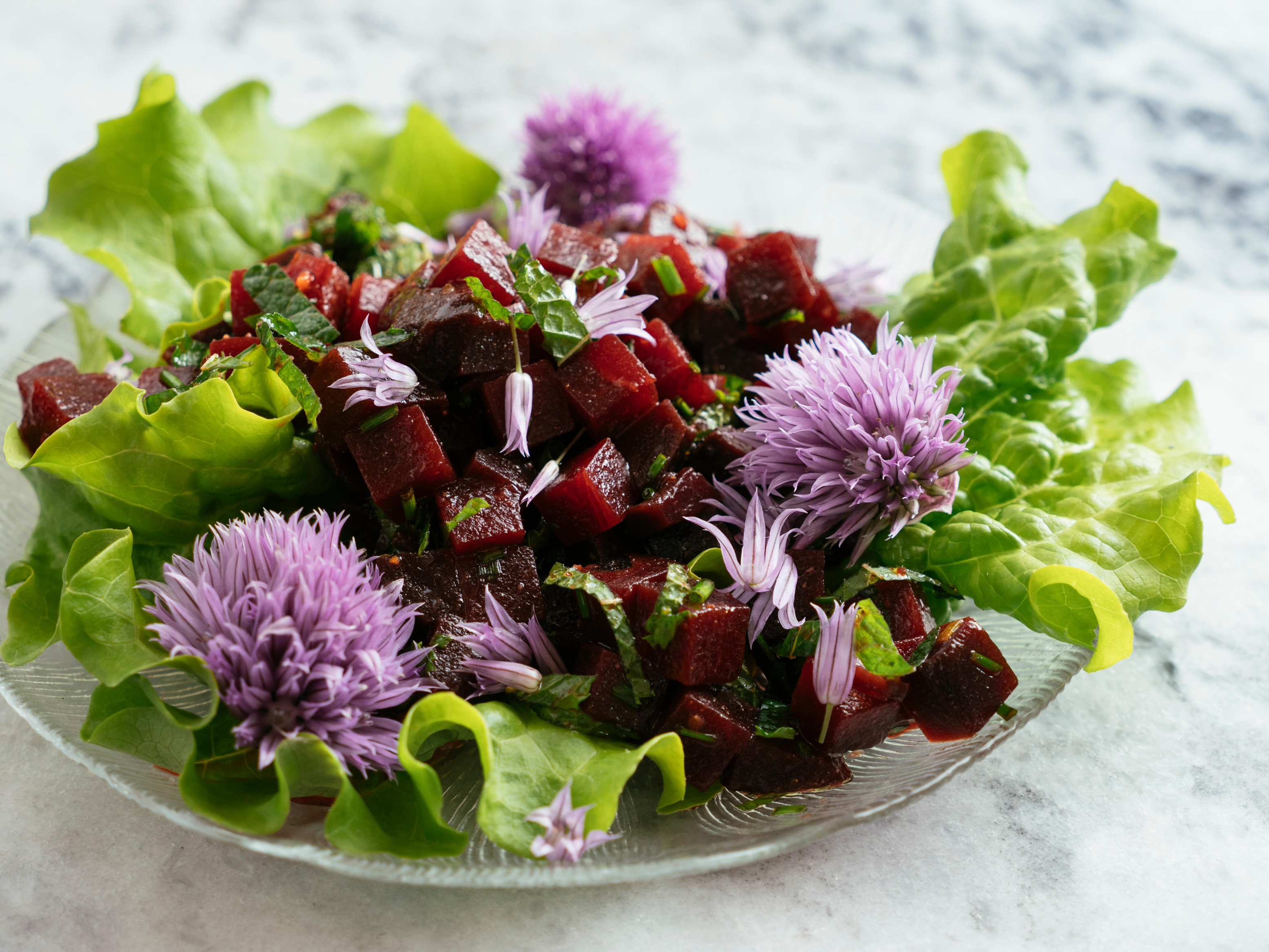 Chive flowers decorate beetroot salad (Alamy/PA)