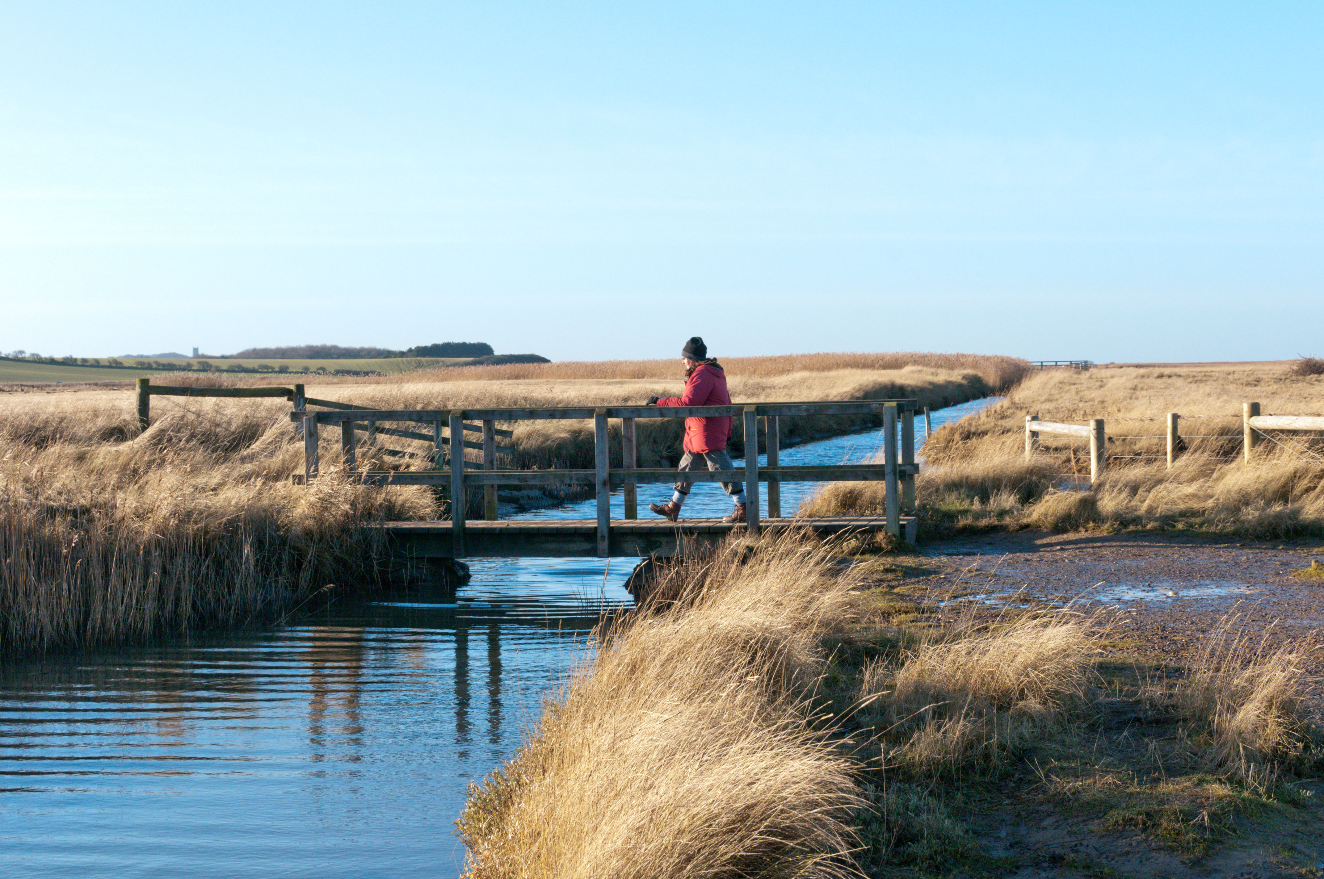 Woman crossing a footbridge