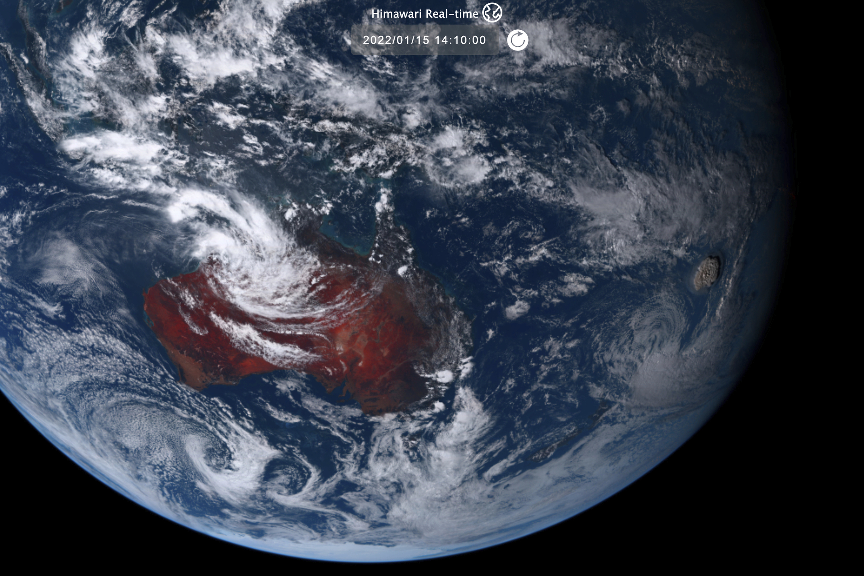 This satellite image taken by Himawari-8, a Japanese weather satellite operated by Japan Meteorological Agency and released by National Institute of Information and Communications Technology, shows an undersea volcano eruption, right, at the Pacific nation of Tonga 