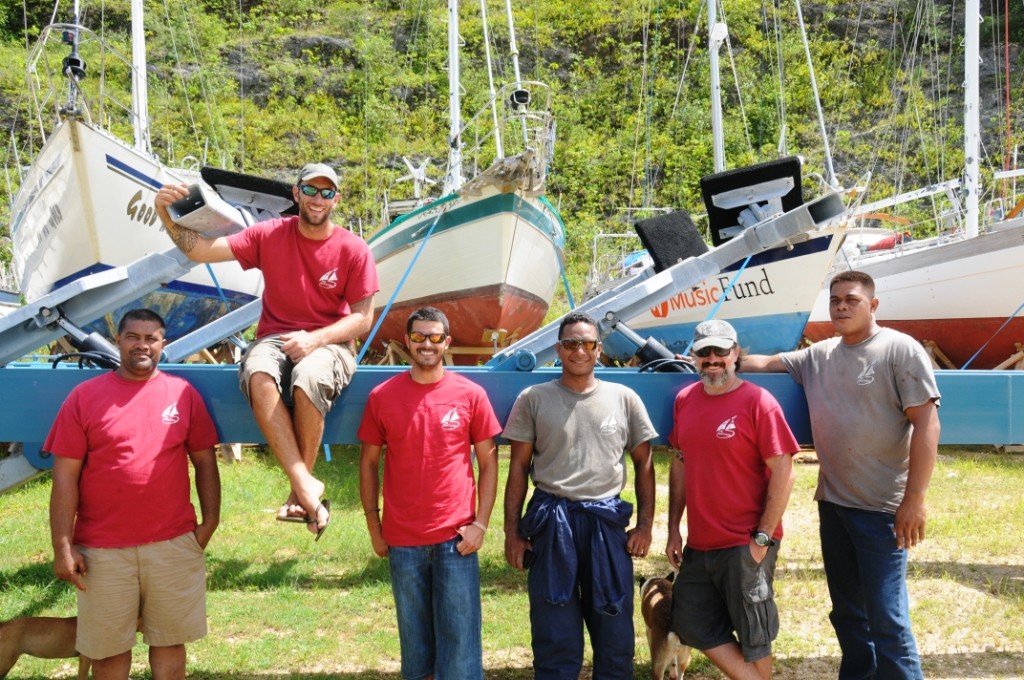 The team at The Boatyard pictured in front of a boat (Kate Walker/PA)