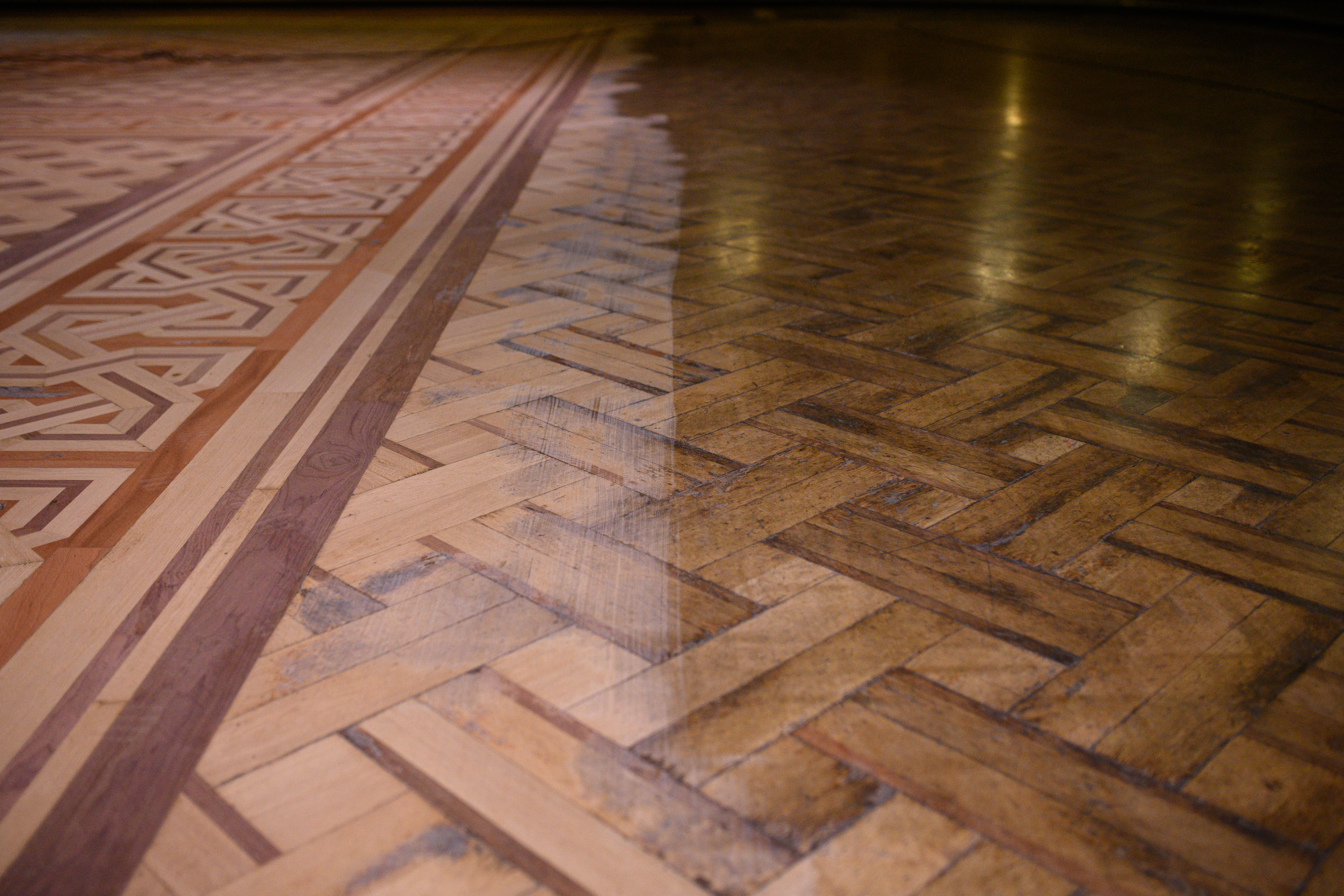 An example of the original and partially restored sections of the floor of the historic Blackpool Tower Ballroom as wood sanding technicians work to restore it to its former glory (Oli Scarff/Blackpool Tower/PA)