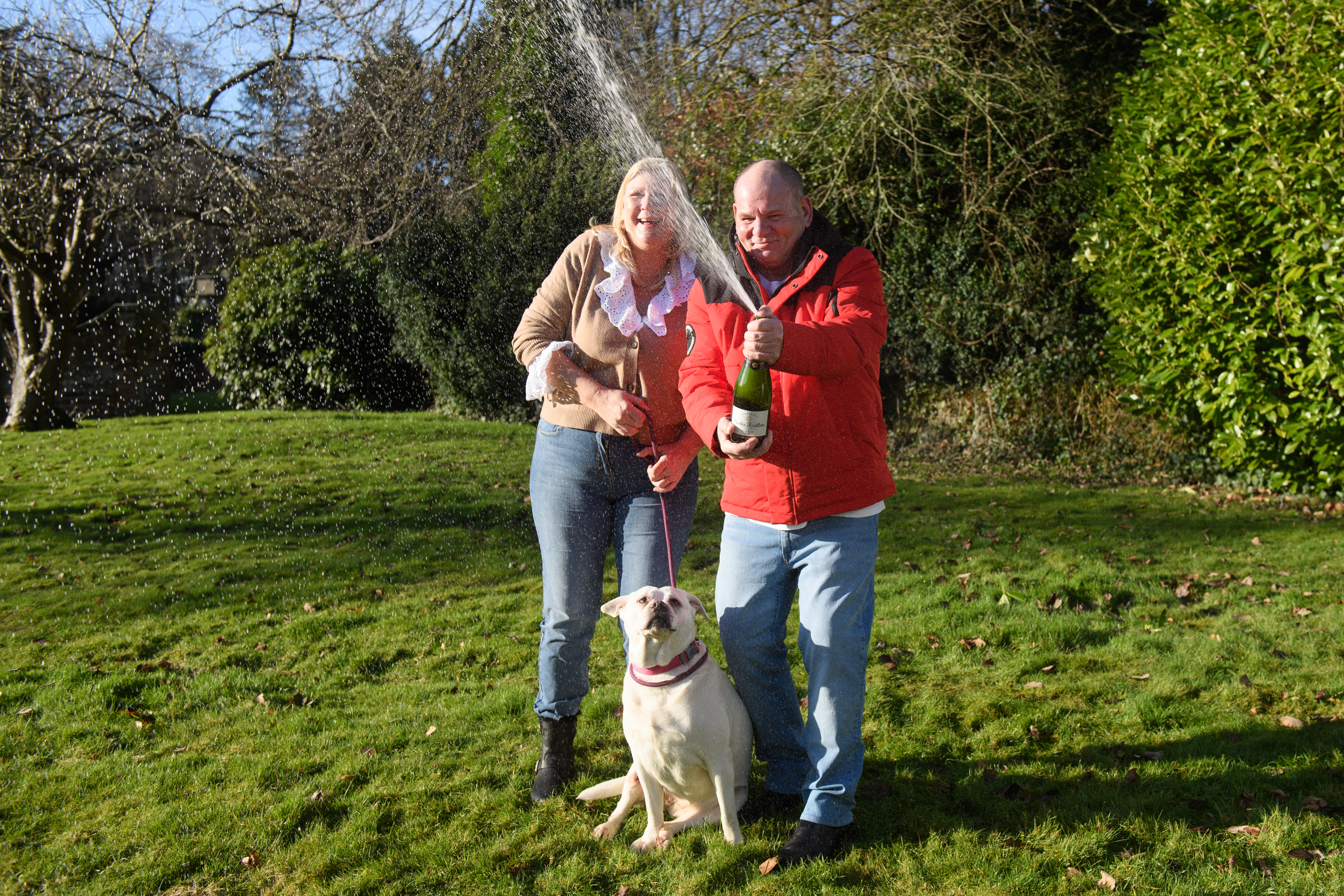 Ian, Sandra and their dog Meg. Ian almost did not get the scratch card as roadworks were placed outside the shop. Picture from Oli Scarff/Camelot