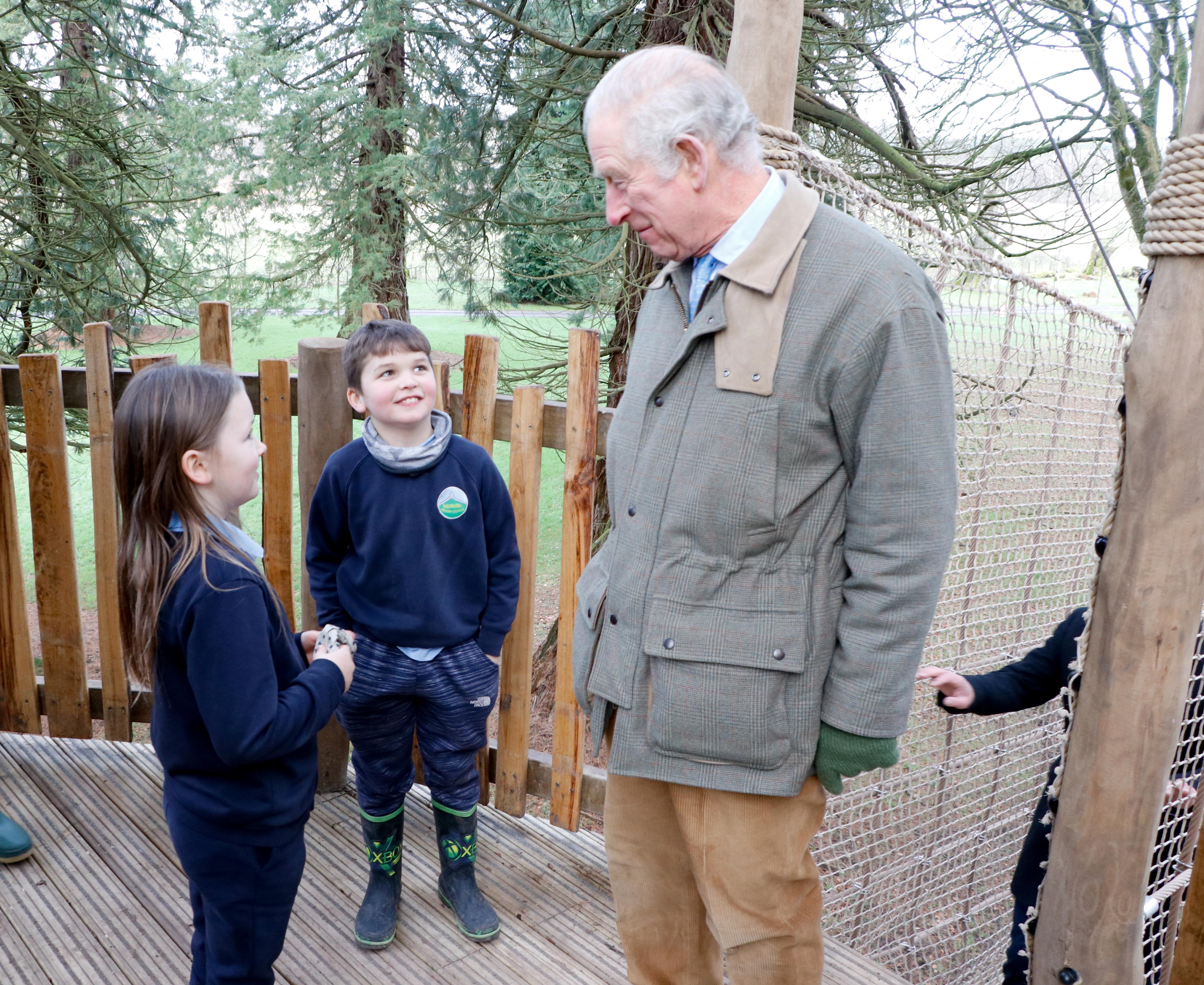 Charles chatting to youngsters as he explored the playpark 