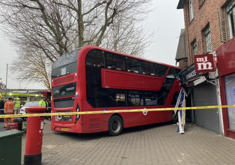 Pictures posted on social media show the 212 bus that collided with a shop front in Highams Park, east London on Tuesday.