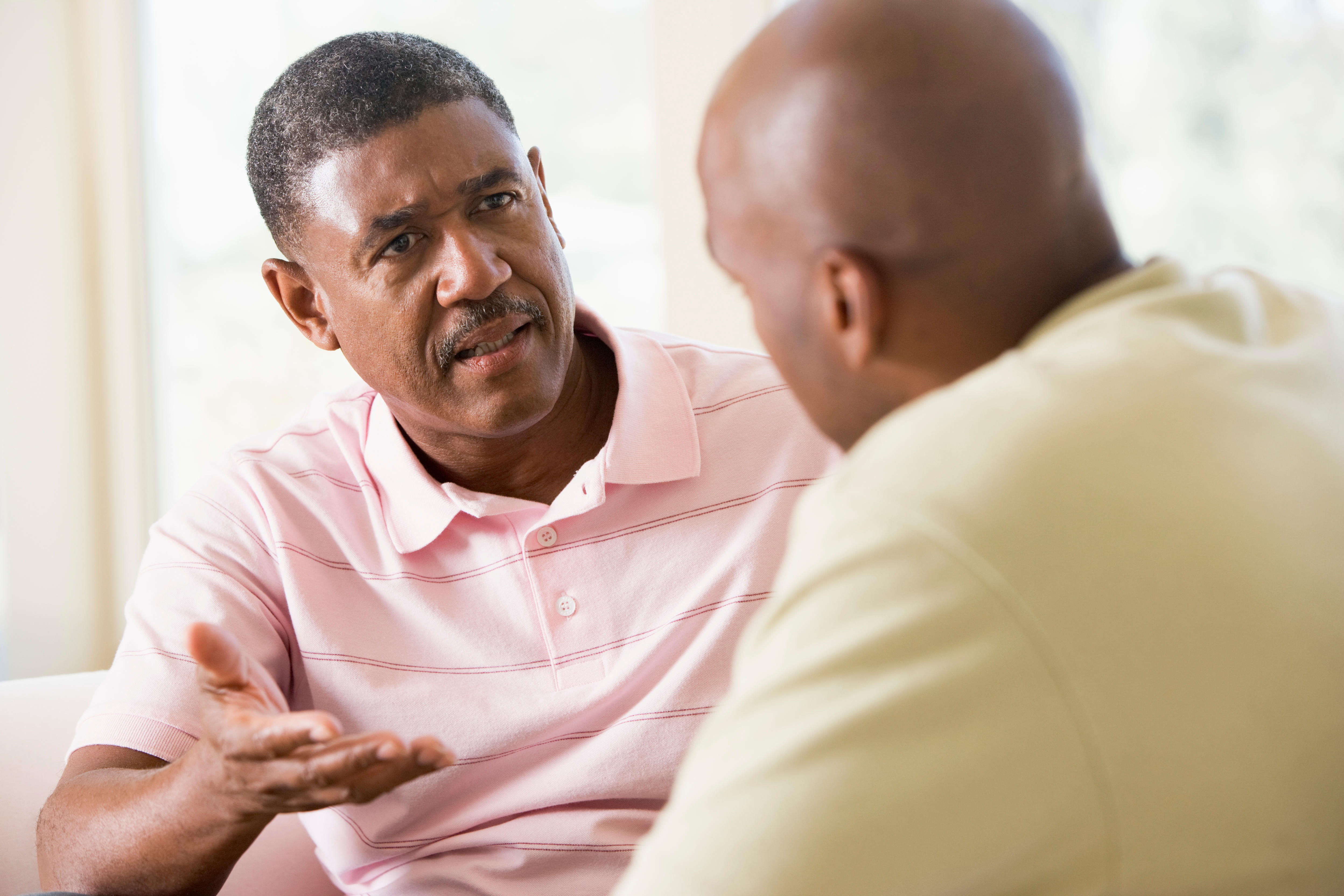 Two male friends talking