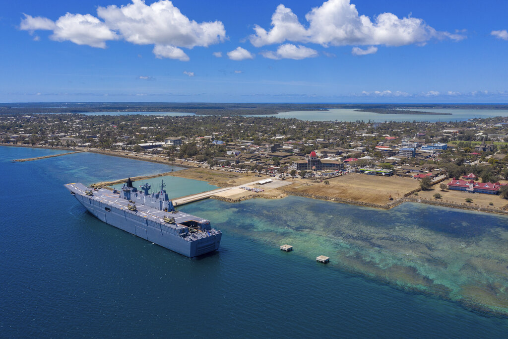 In this photo provided by the Australian Defence Force, HMAS Adelaide is docked at Nuku'alofa, Tonga, Thursday, Jan. 27, 2022, after carrying disaster relief and humanitarian aid supplies.