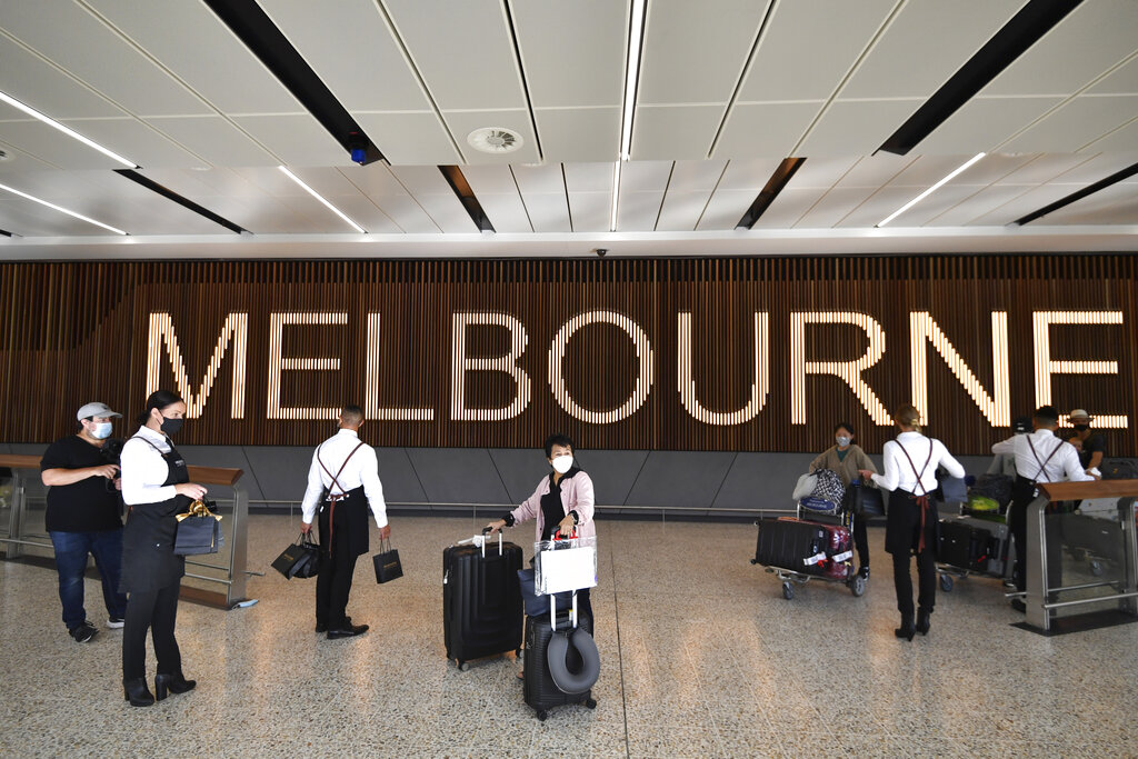 Passengers arrive at Melbourne Airport in Melbourne on Monday