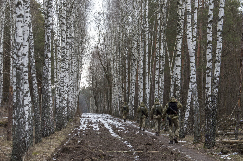 Ukrainian border guard officers patrol the Ukrainian-Belarusian state border at a checkpoint in Novi Yarylovychi, Ukraine 