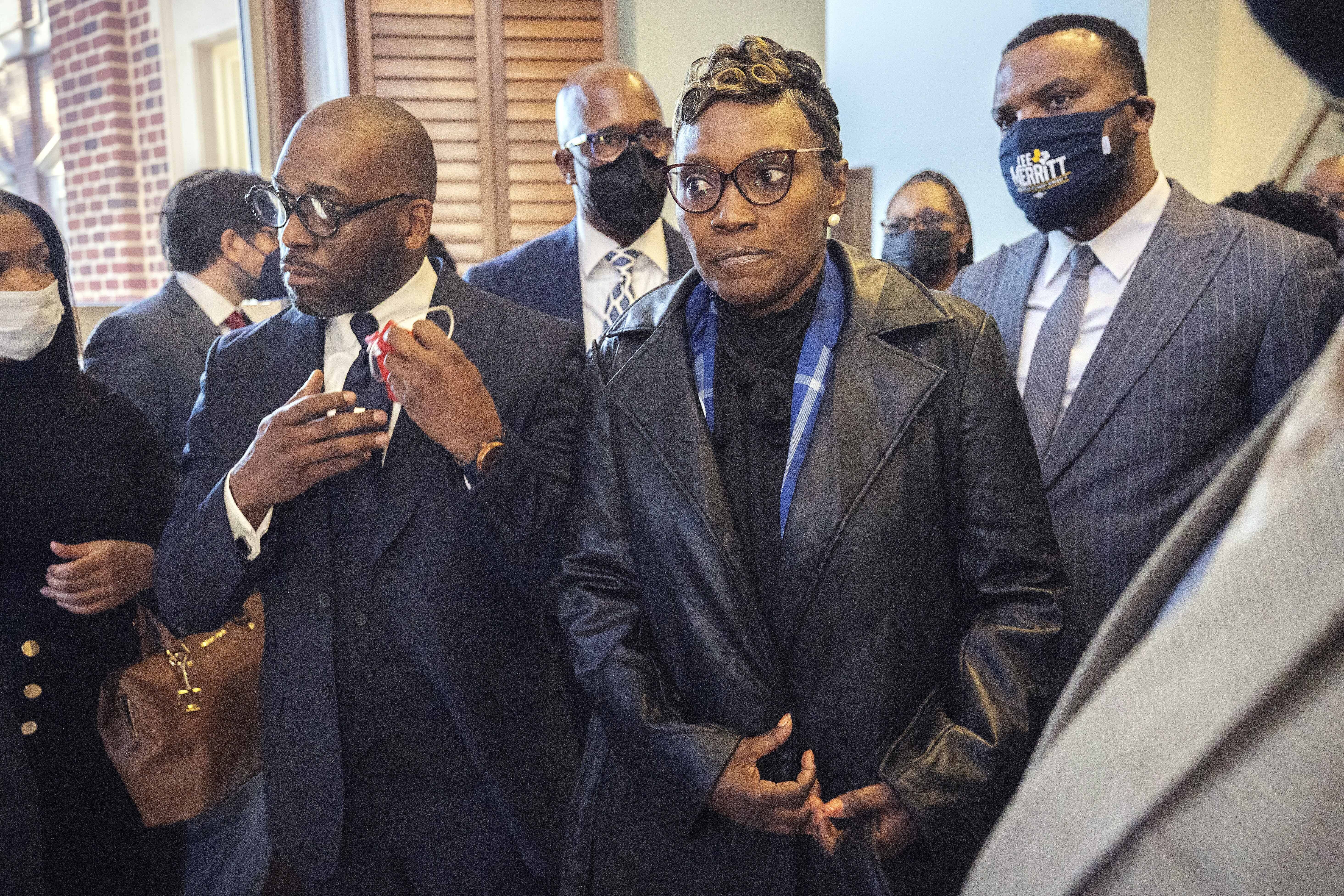 Ahmaud Arbery's mother Wanda Cooper-Jones surrounded by supporters after Superior Court Judge Timothy Walmsley sentenced Greg McMichael, his son, Travis McMichael, and a neighbour, William 'Roddie' Bryan to life in prison in the Glynn County Courthouse on January 7 in Brunswick, Georgia