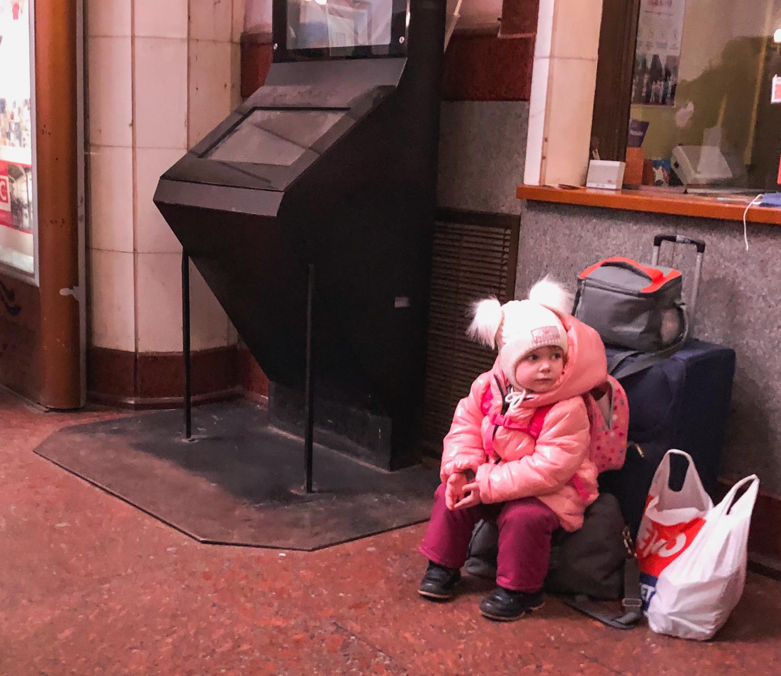 Little girl waiting for train