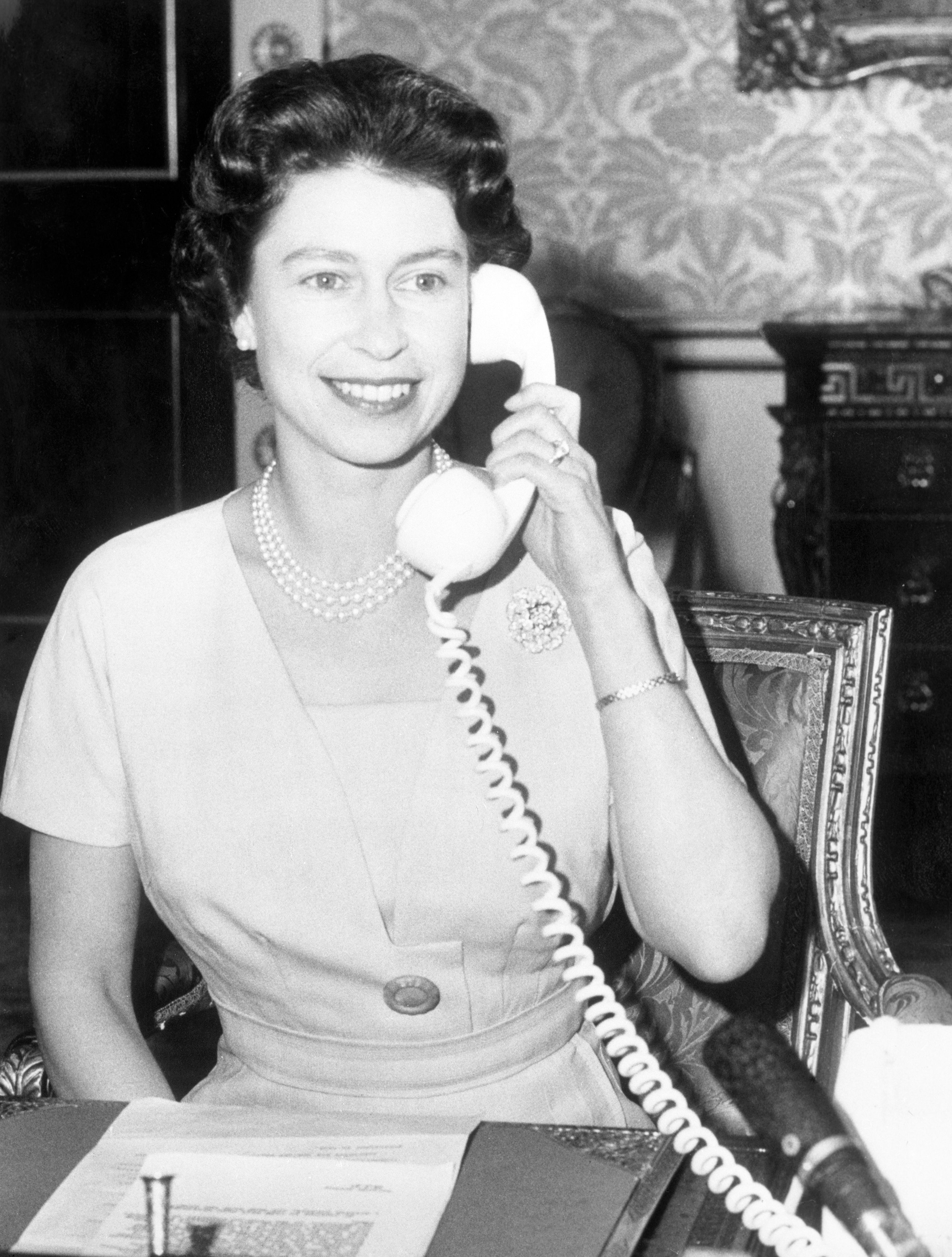 Queen Elizabeth II speaking to John Diefenbaker, Prime Minister of Canada. She was inaugurating CANTAT (Canadian Trans-Atlantic Telephone) cable by making the first call to Ottawa.