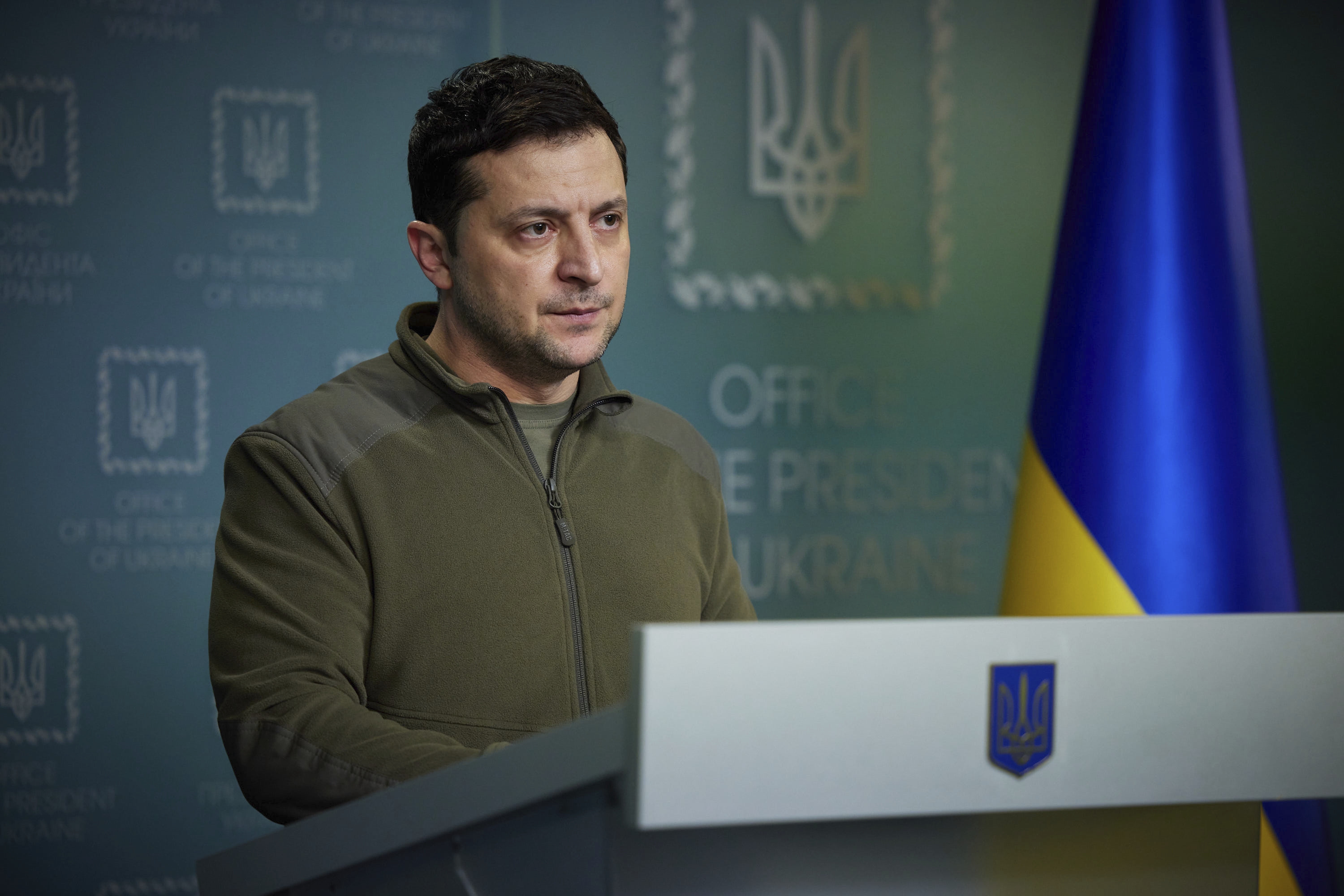 Ukrainian President Volodymyr Zelenskyy delivers his speech addressing the nation in Kyiv, Ukraine, Friday, Feb. 25, 2022. Russian troops bore down on Ukraine's capital Friday, with explosions and gunfire sounding in the city as the invasion of a democratic country fuelled fears of wider war in Europe and triggered new international efforts — including direct sanctions on President Vladimir Putin — to make Moscow stop.