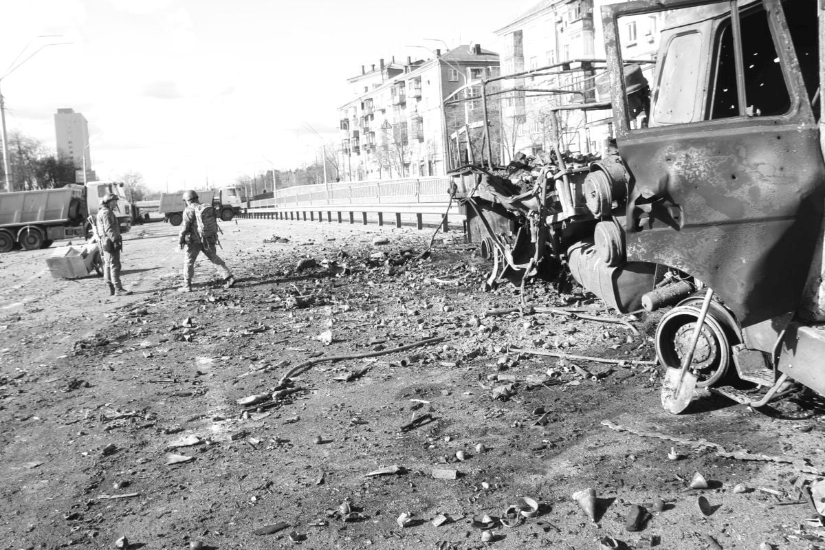 Photographs show smashed cars and rubble on the streets.