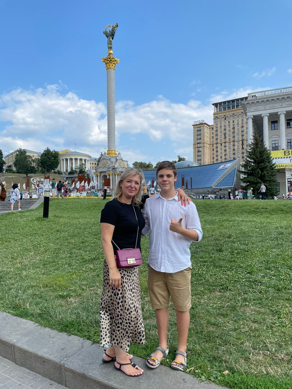Nikita Dudchenko, 14, with his mother in Kyiv