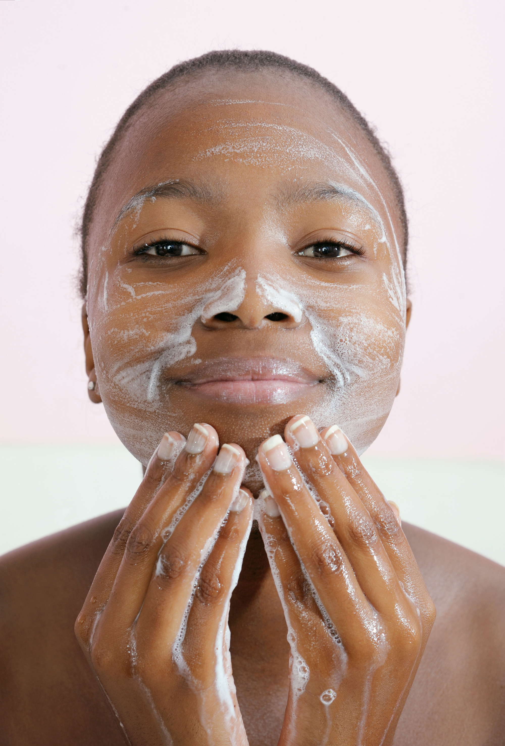 Woman washing her face