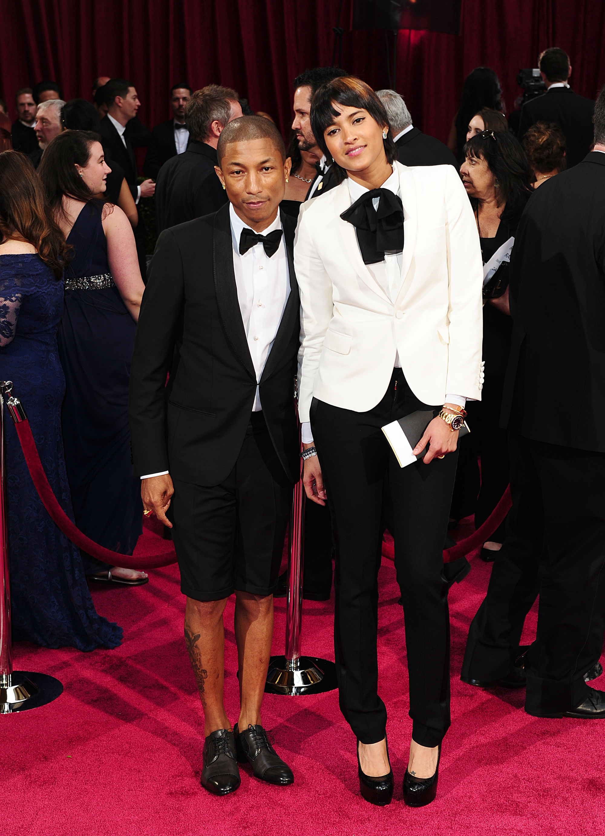 Pharrell Williams and Helen Lasichanh arriving at the 86th Academy Awards 