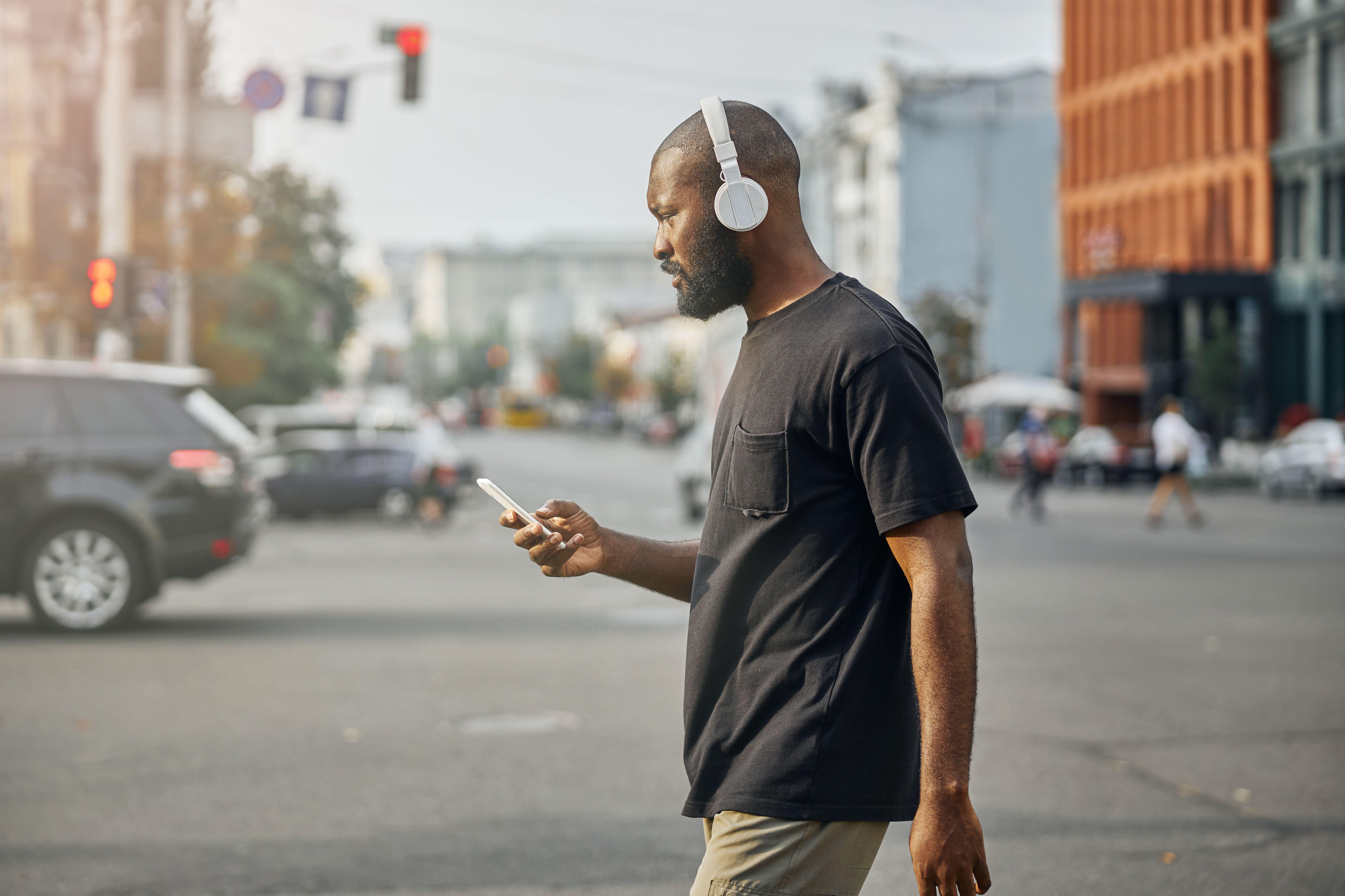 Man walking listening to music