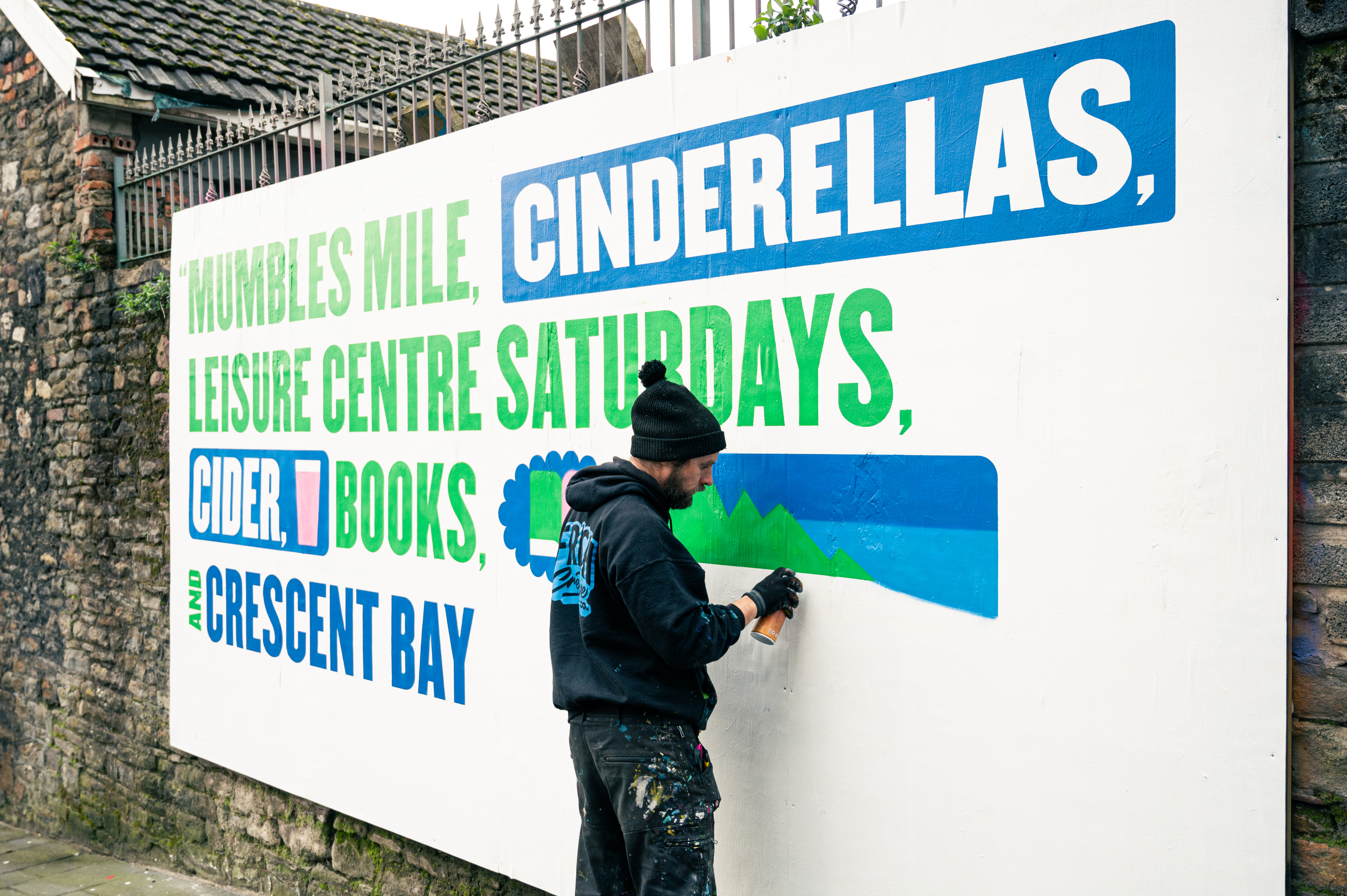 Murals painted on hoardings around Swansea are to welcome concertgoers. (Johan B. Skre, @photomanjohan)