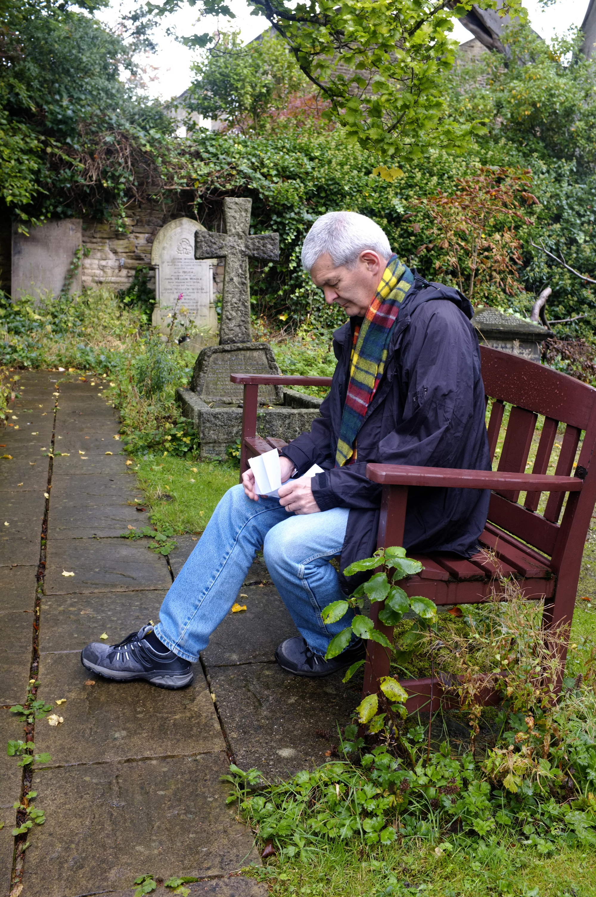  Man Grieving at Graveside