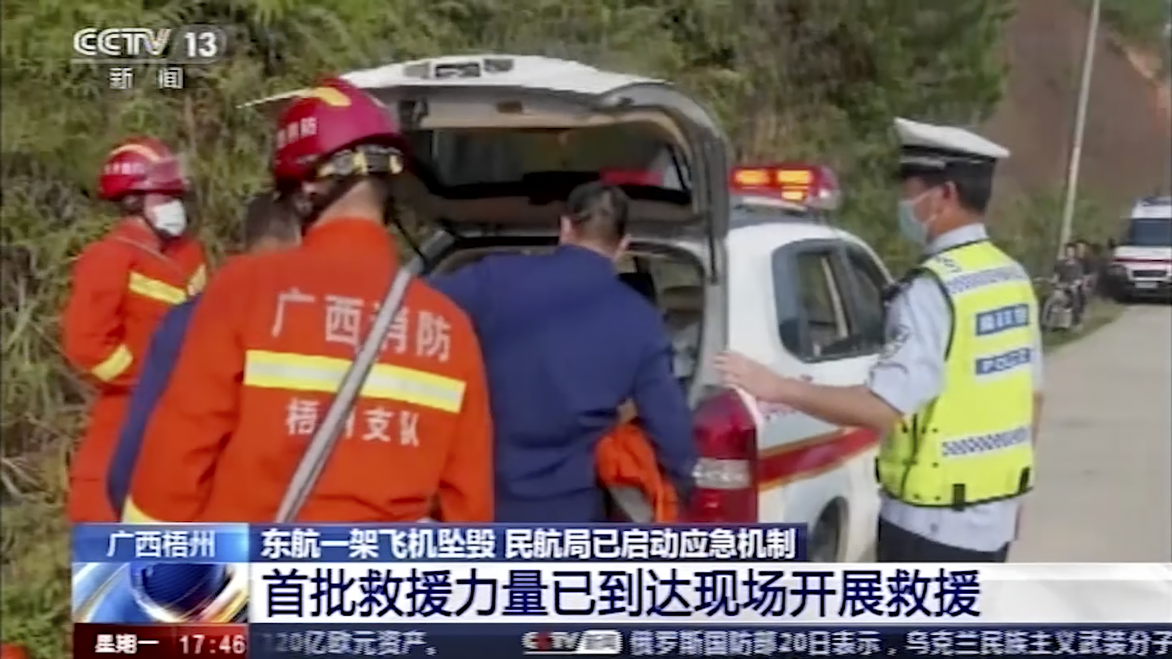 In this image taken from video footage run by China's CCTV, emergency personnel prepare to travel to the site of a plane crash near Wuzhou in southwestern China's Guangxi Zhuang Autonomous Region 
