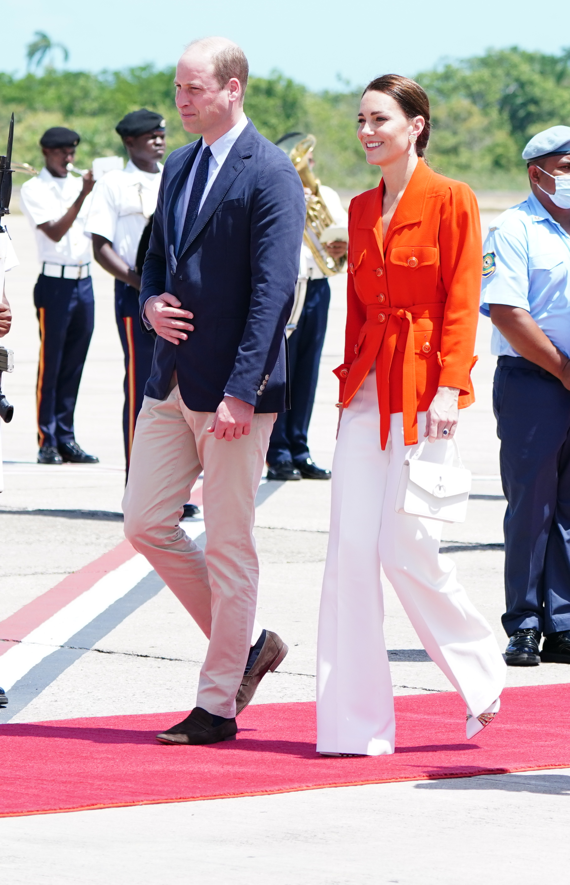 The Duke and Duchess of Cambridge board a plane as they depart from Philip S. W Goldson International Airport, Belize