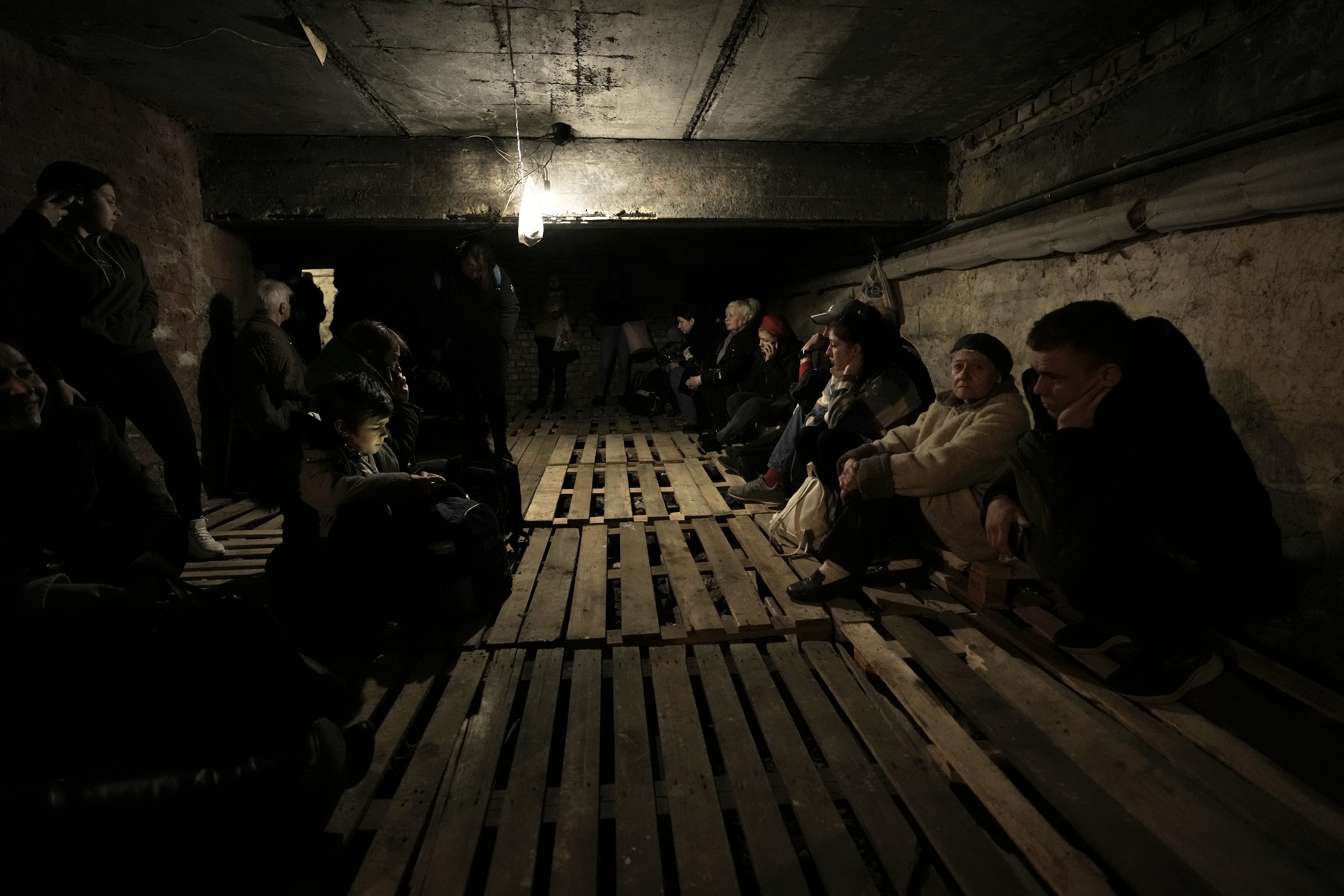 People shelter underground following explosions in Lviv, western Ukraine 