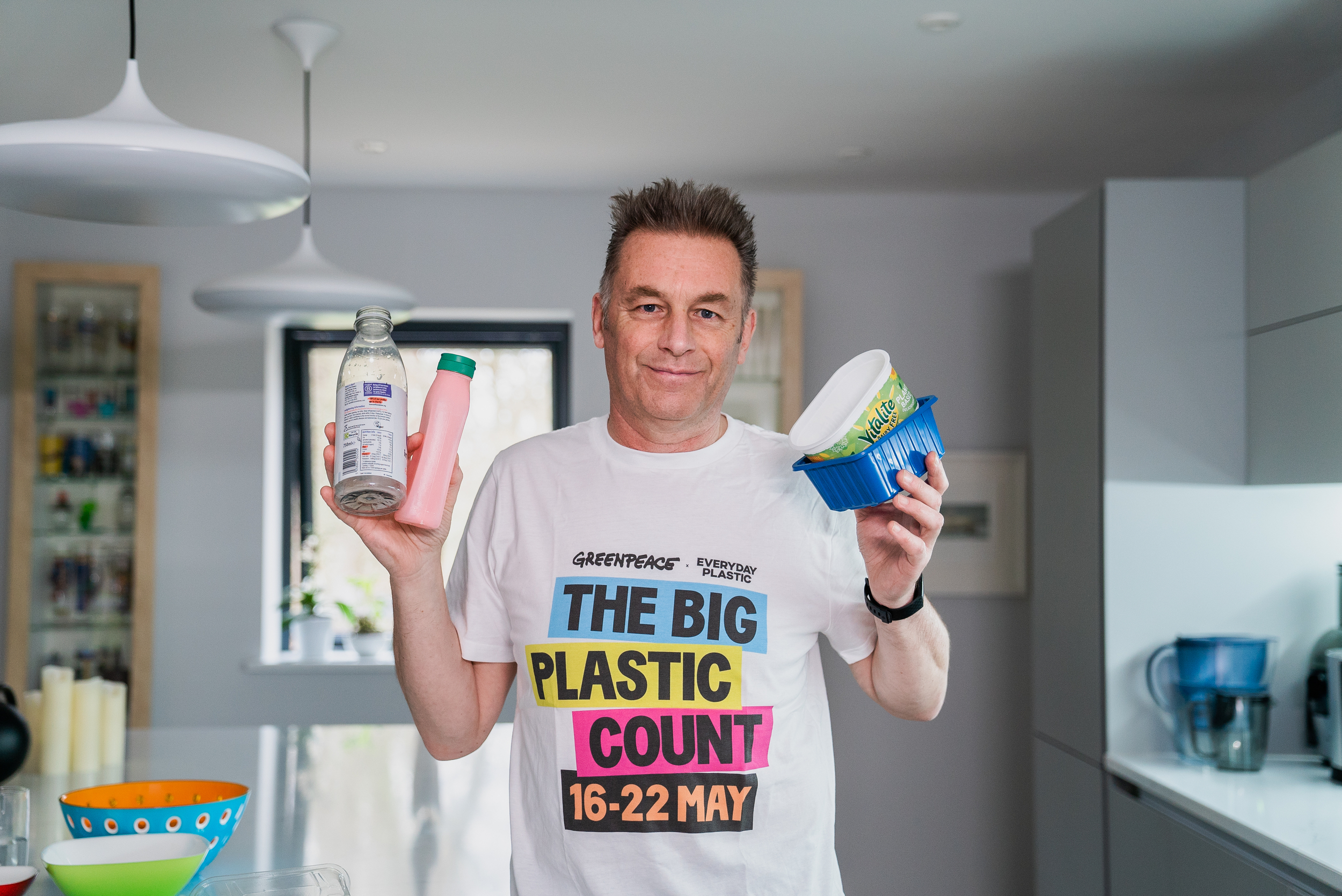 Chris Packham holding up plastic packaging