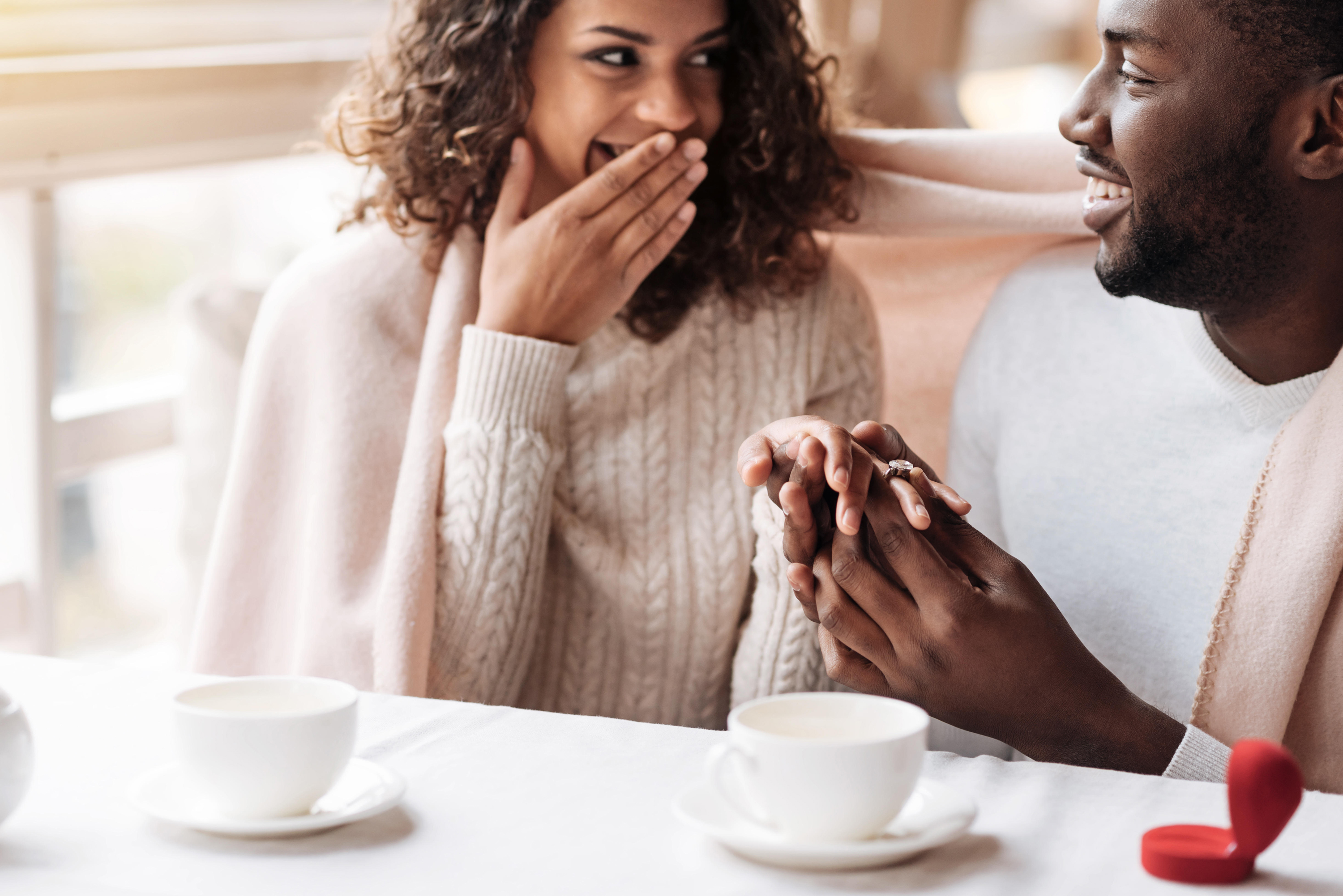 Couple getting engaged in the cafe