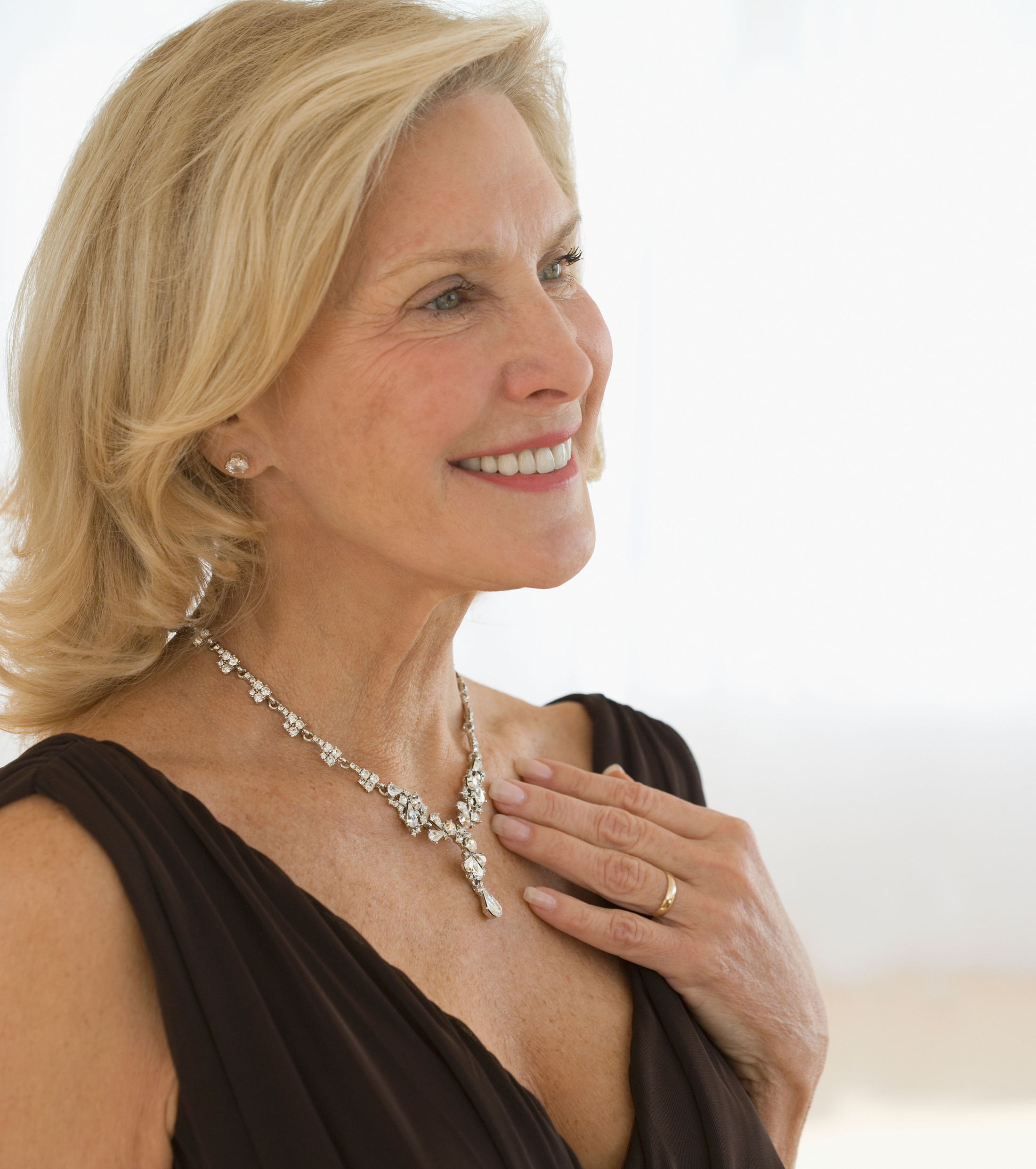  woman wearing diamond necklace