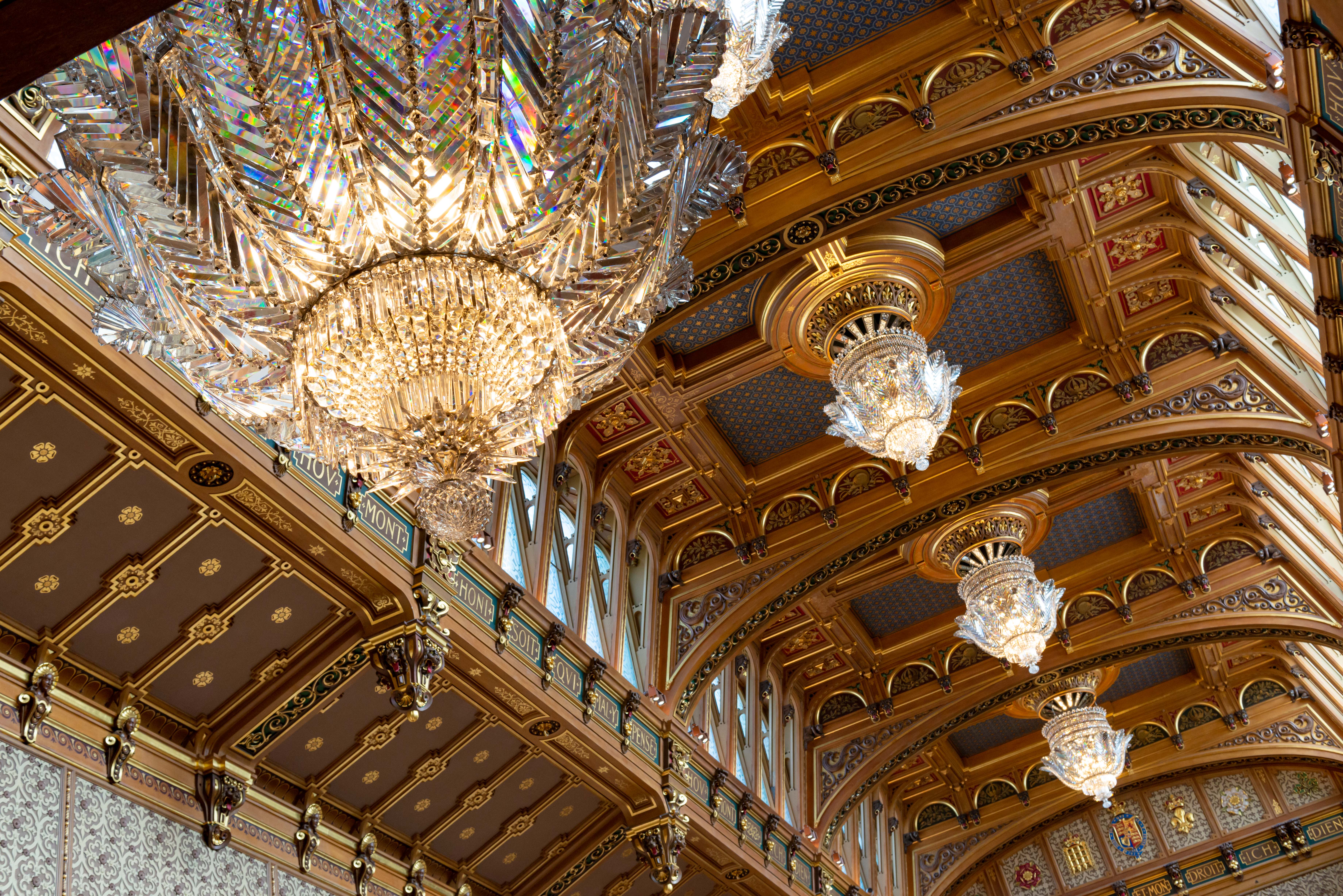 The opulent chandeliers hanging from the ceiling of the Waterloo Chamber 