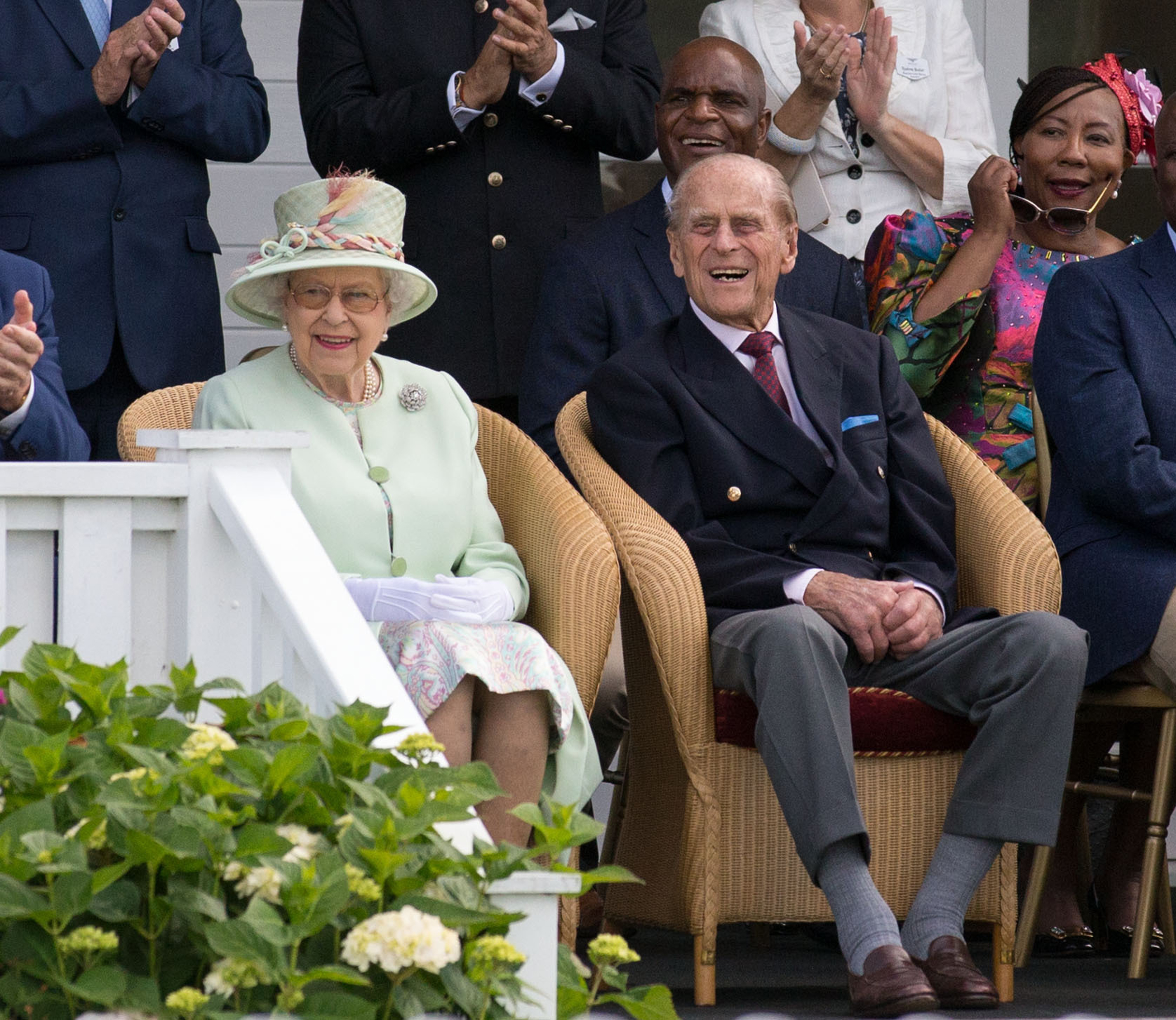 The Queen and the Duke of Edinburgh watch a British Driving Society parade
