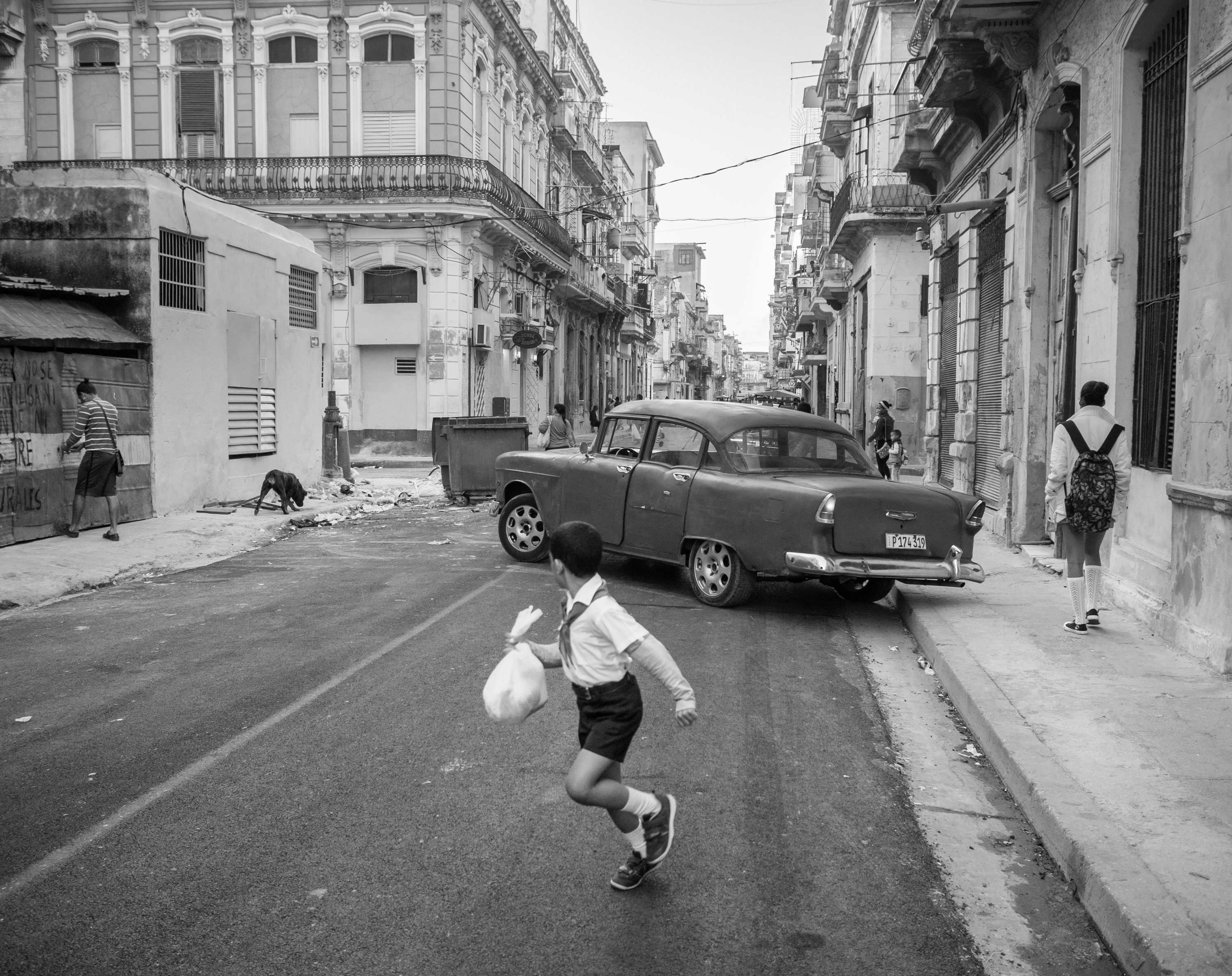 Young boy running in street