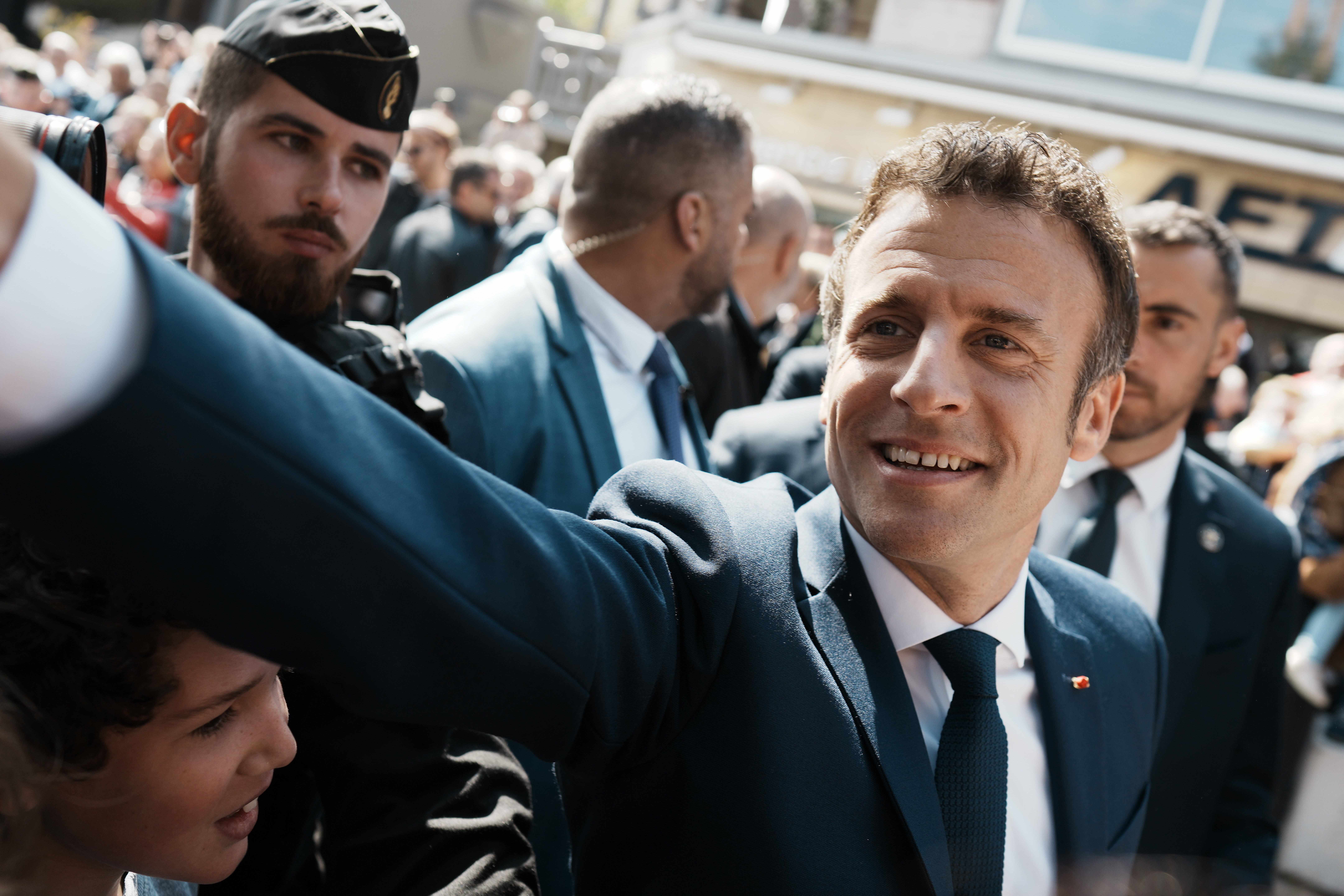 French President and centrist candidate Emmanuel Macron shakes hands with well-wishers as he heads to the polling station in Le Touquet, northern France