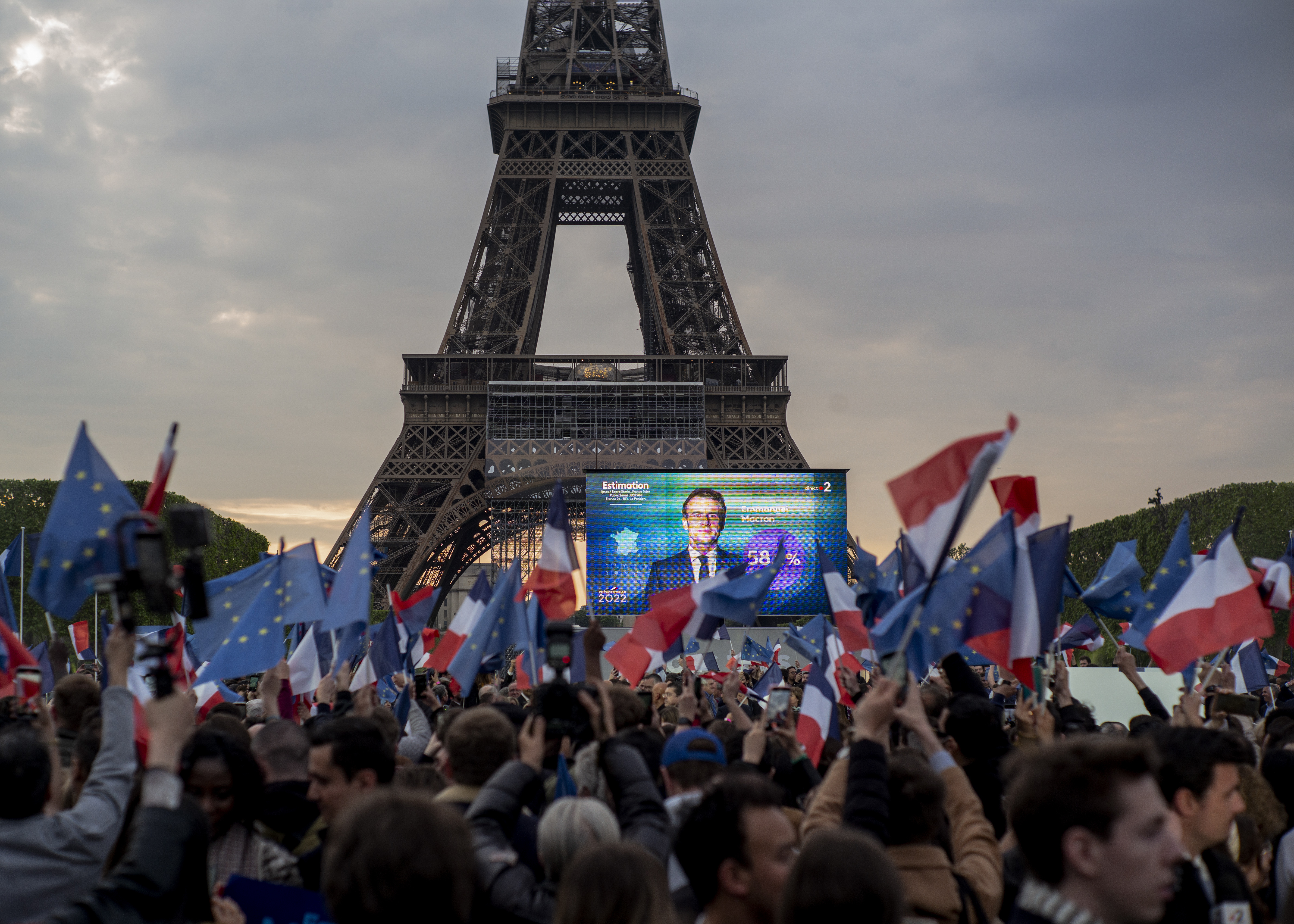 French President Emmanuel Macron celebrates with supporters in front of the Eiffel Tower Paris, France