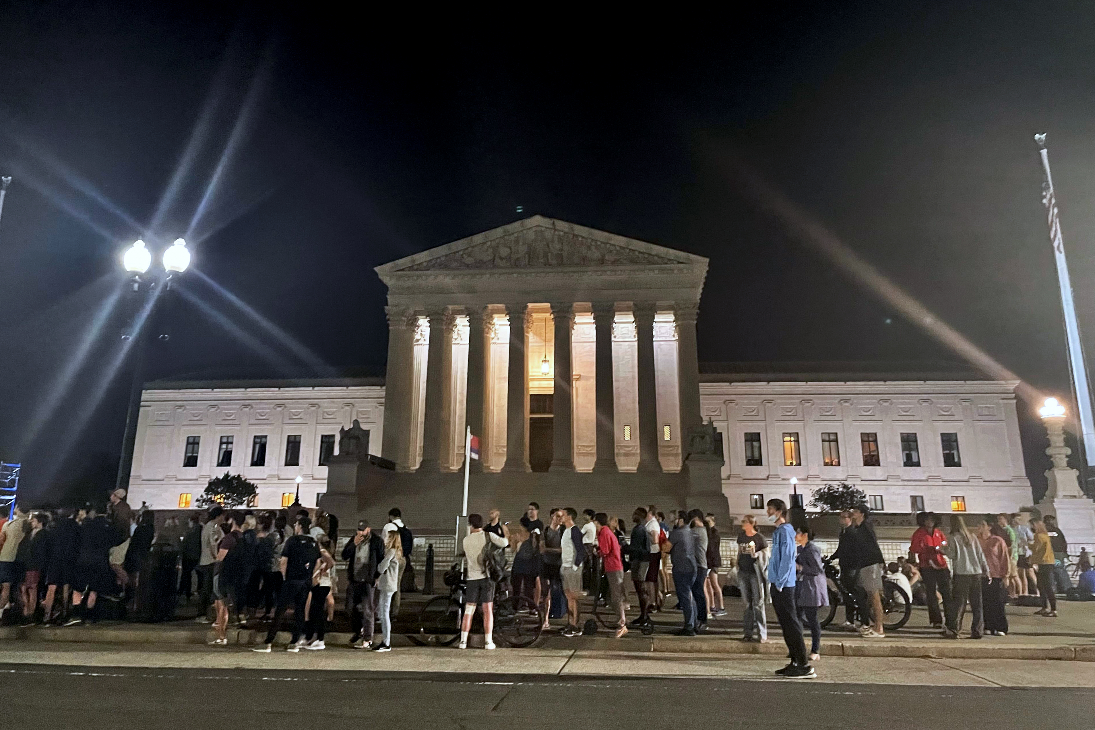A crowd of people outside the Supreme Court on Monday night 