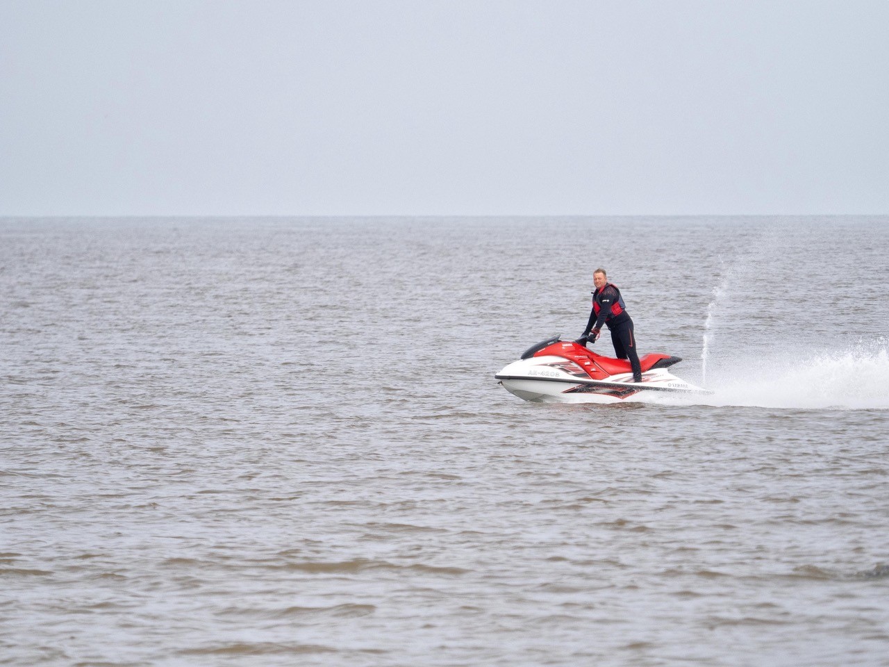 Jet skiers near seals