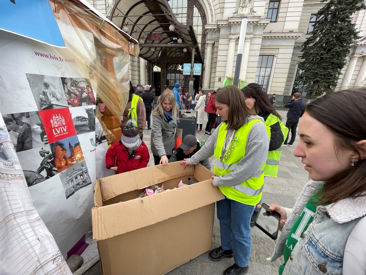 Volunteers handing out toys at Lviv railway station