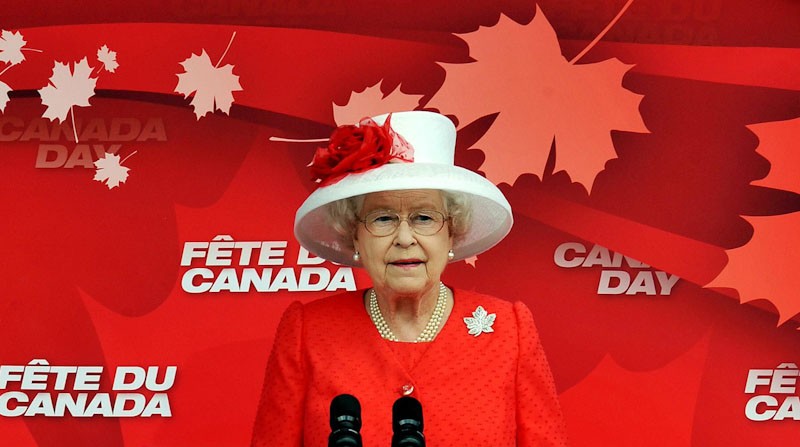 The Queen wearing the Maple Leaf Brooch and the colours of the Canadian Flag during a tour to Canada