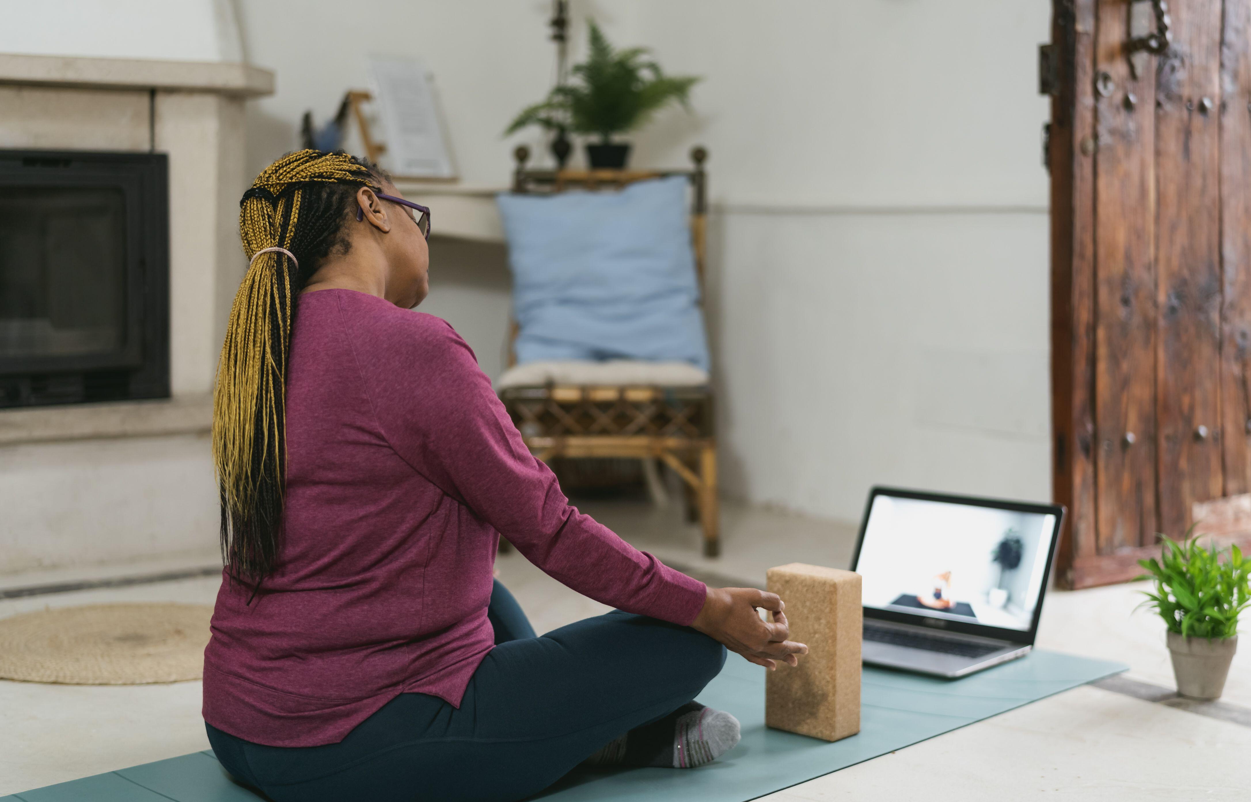 Black woman doing yoga at hope
