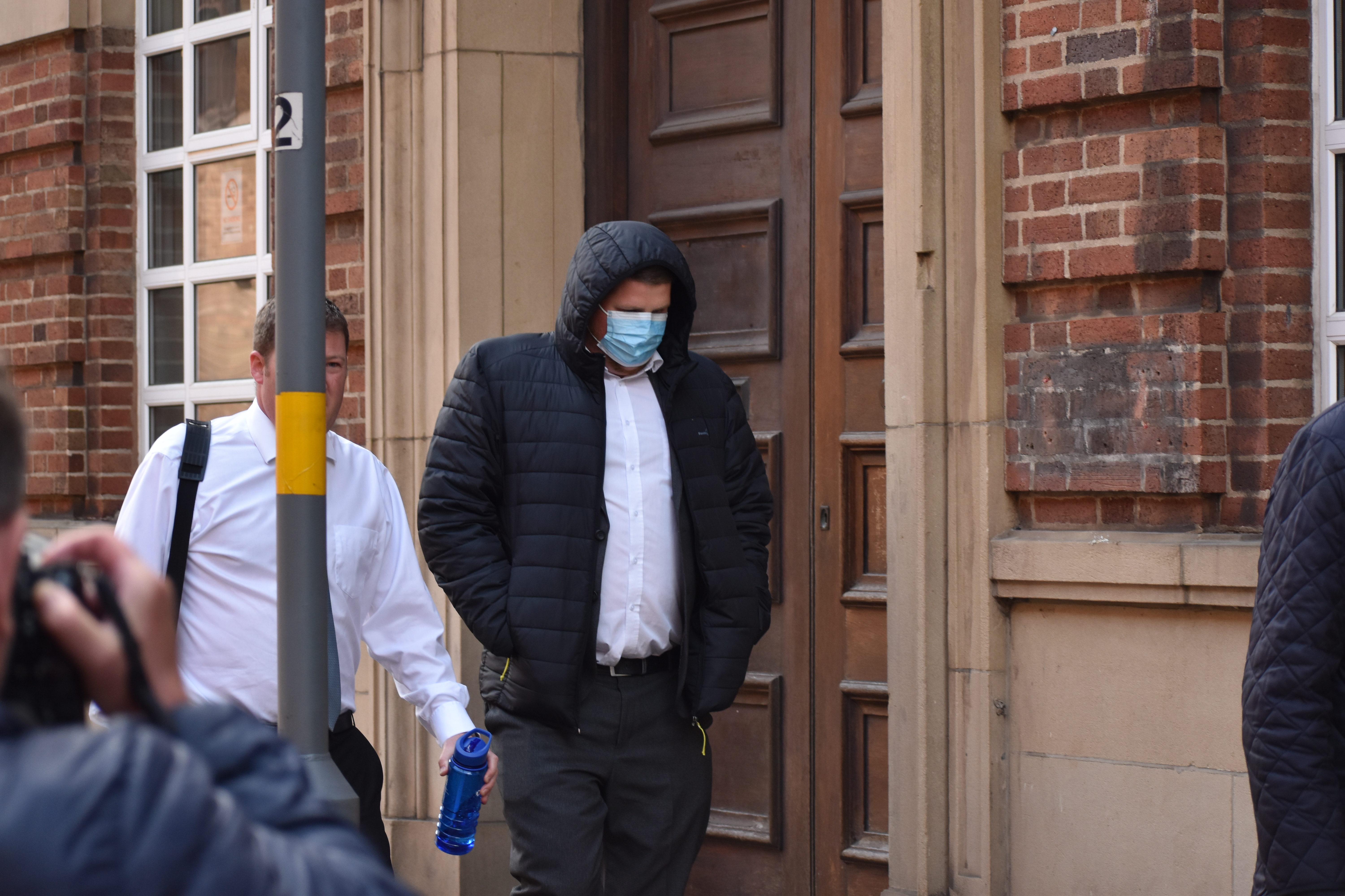 James Watts (right) was accompanied by Police Federation representatives for the court hearing.