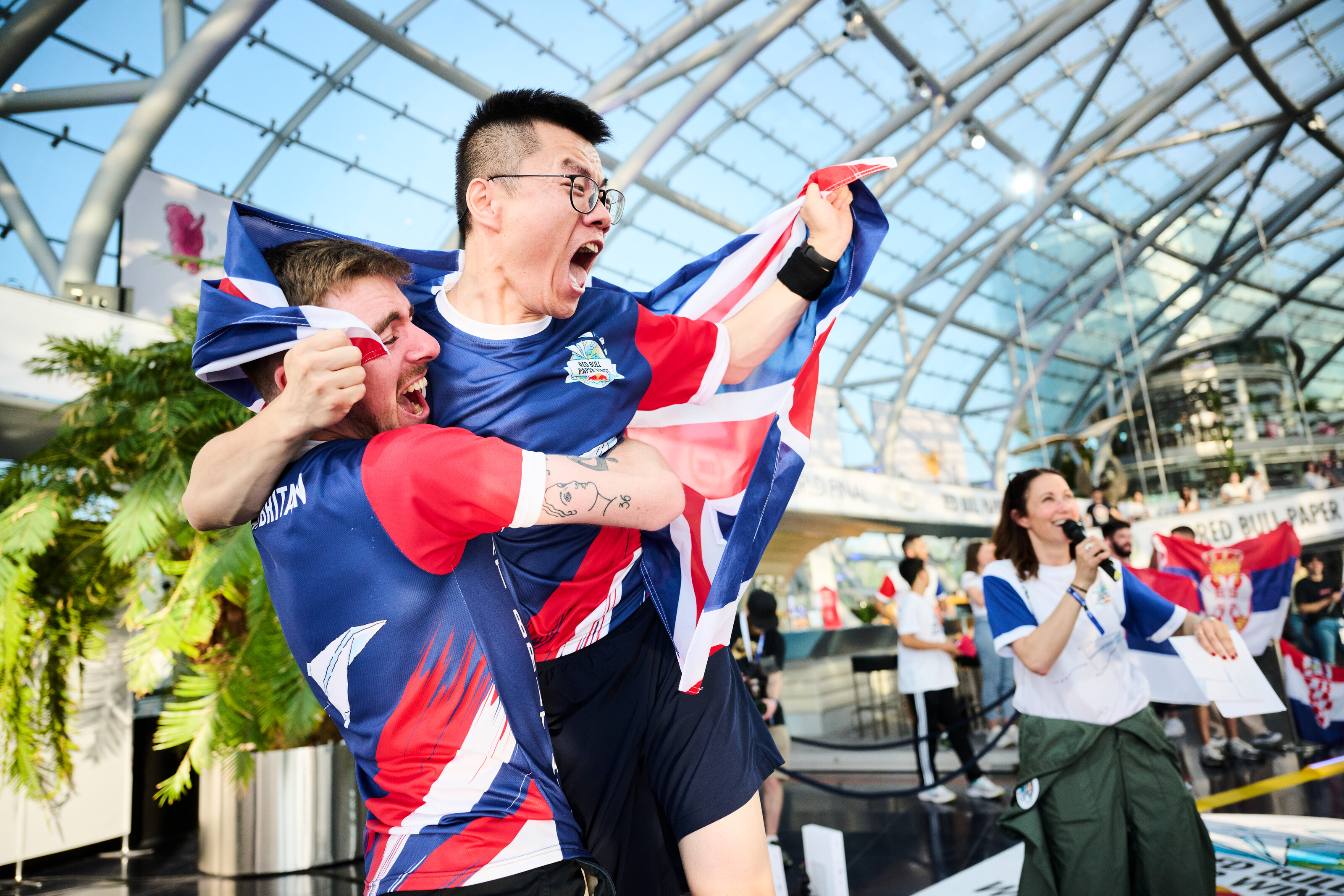 Yicheng Sun of Great Britain celebrate with his team at the Longest Distance discipline during the Red Bull Paper Wings World Finals 2022 in Salzburg, Austria. (Red Bull Paper Wings)