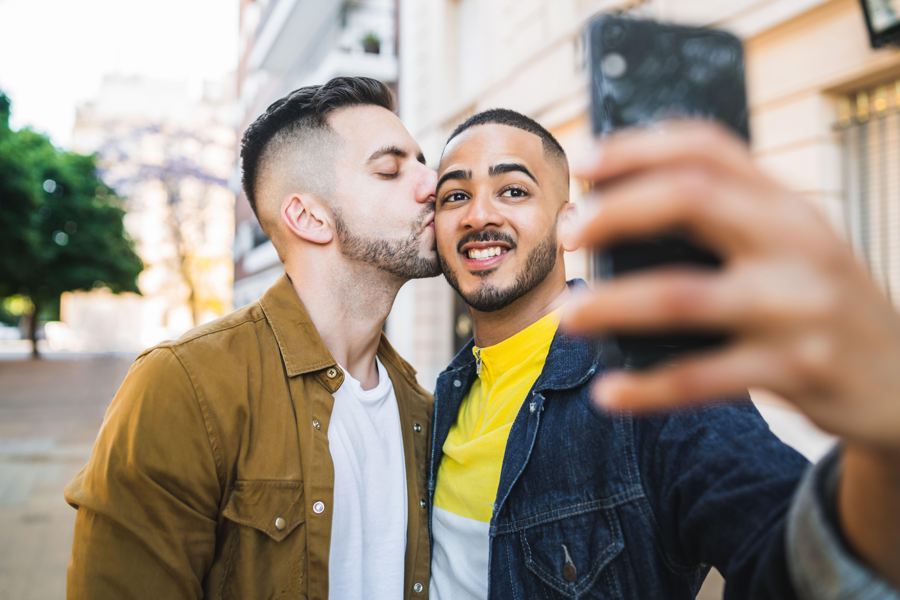 Gay couple posing for selfie