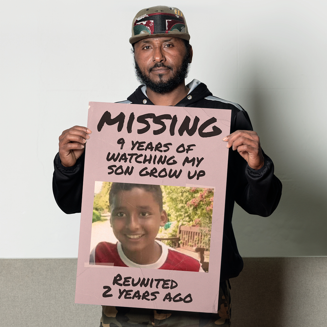 Osman pictured holding a missing poster, which mentions that he missed out on nine years with his son 