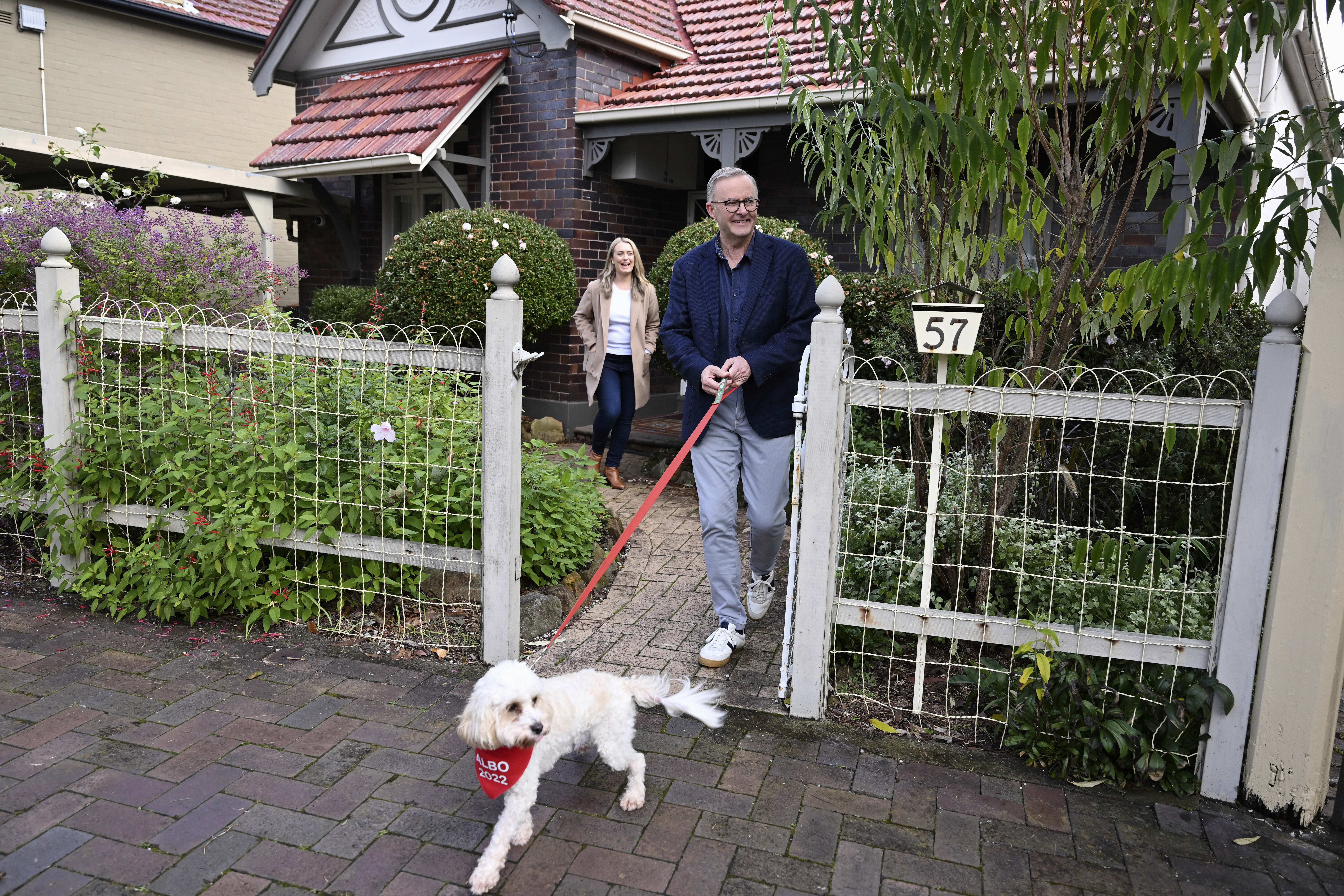 Anthony Albanese and his partner Jodie Haydon walk their dog, Toto, in Sydney 