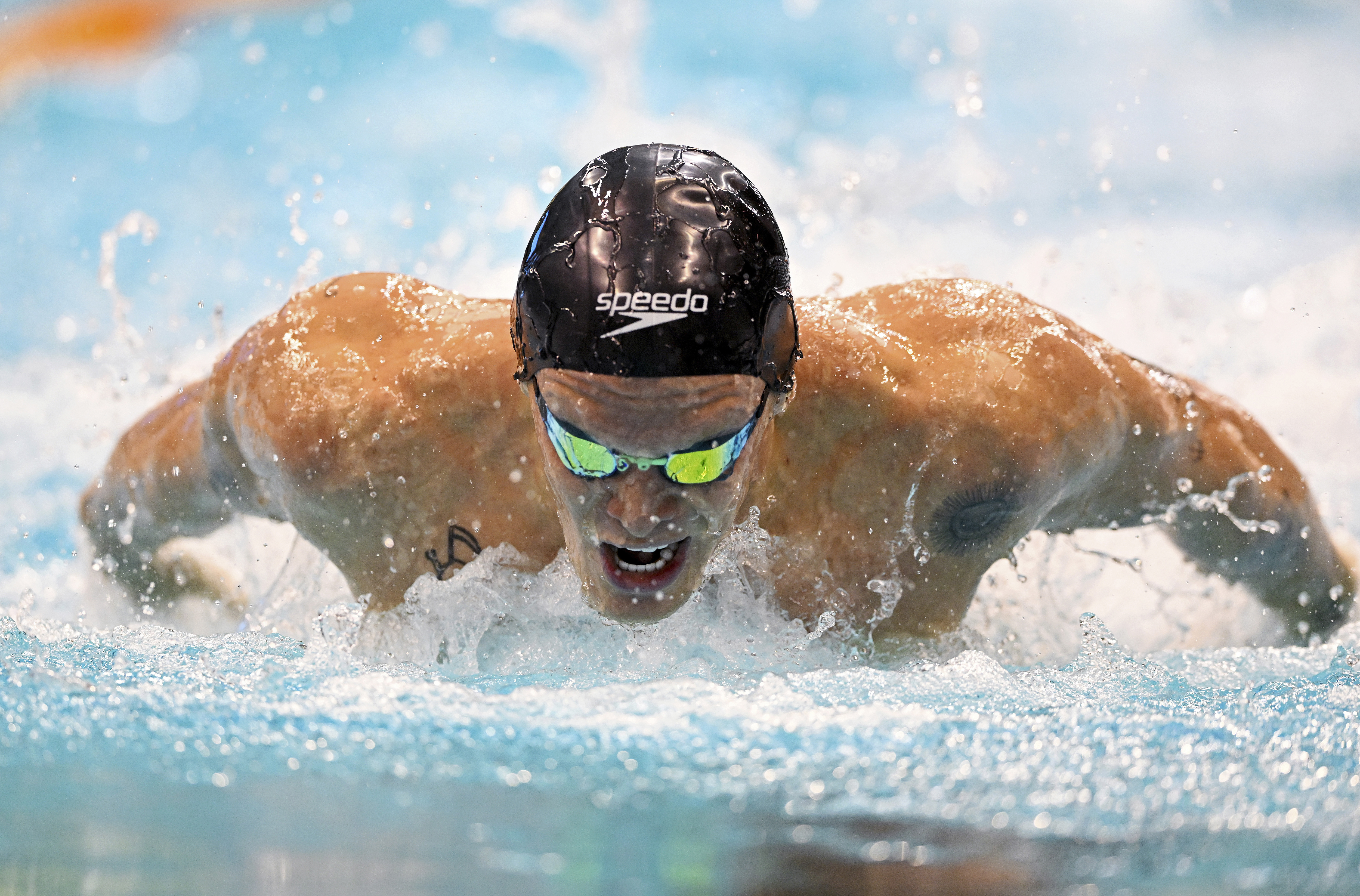 Cody Simpson competes during the men's 100m butterfly heats at the Australian swimming championships in Adelaide