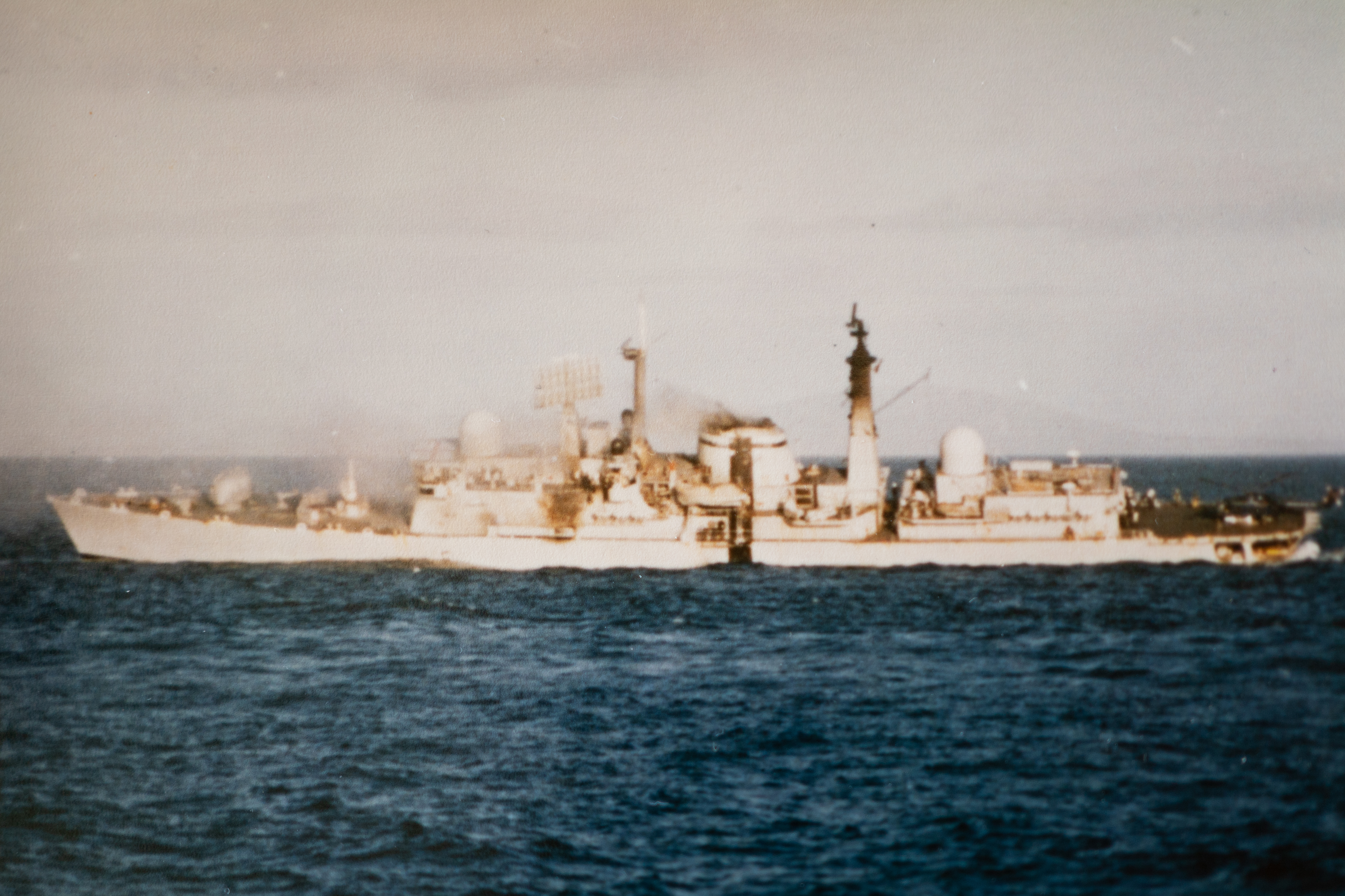 HMS Coventry listing to one side after being hit
