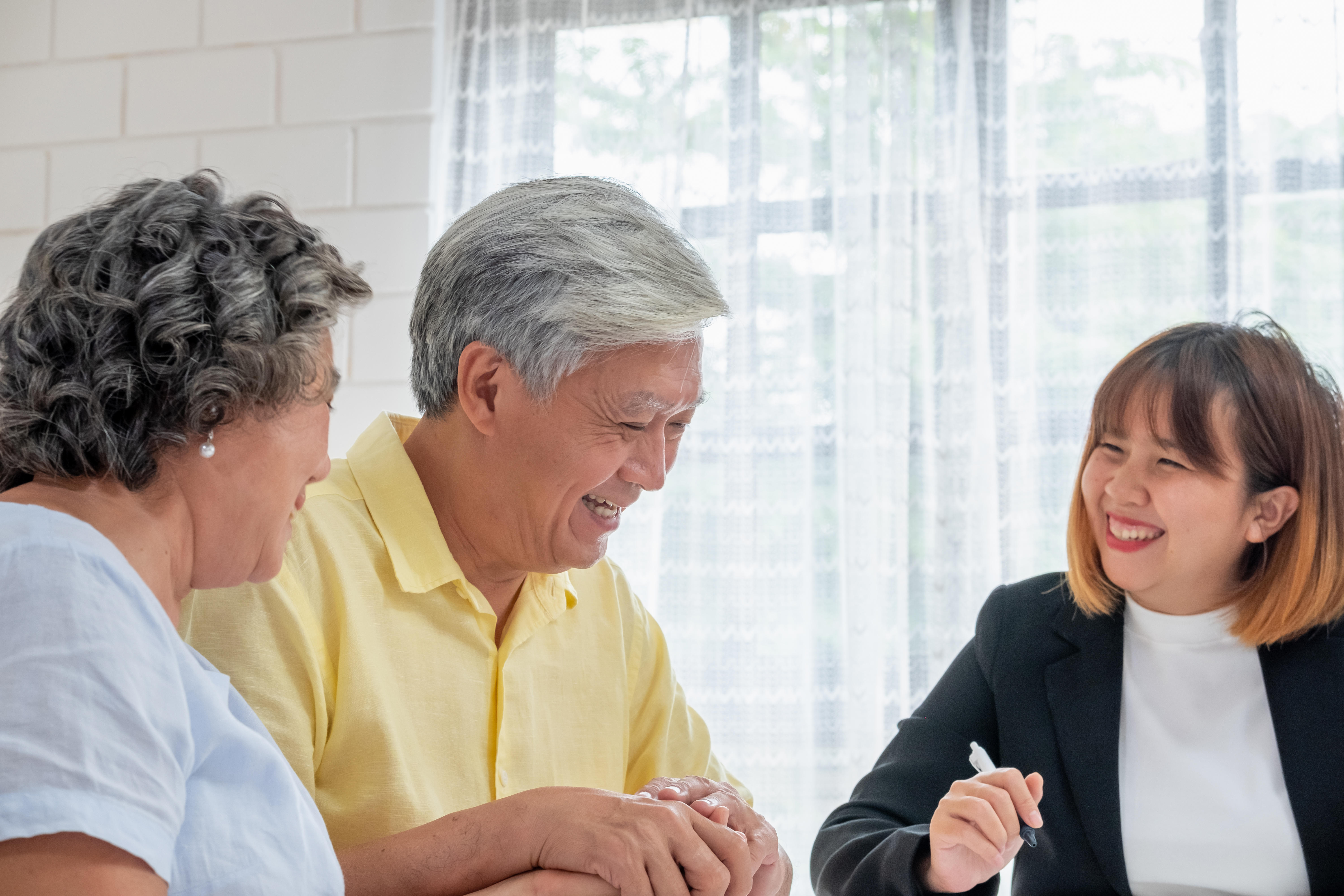 Older couple speaking with a financial advisor