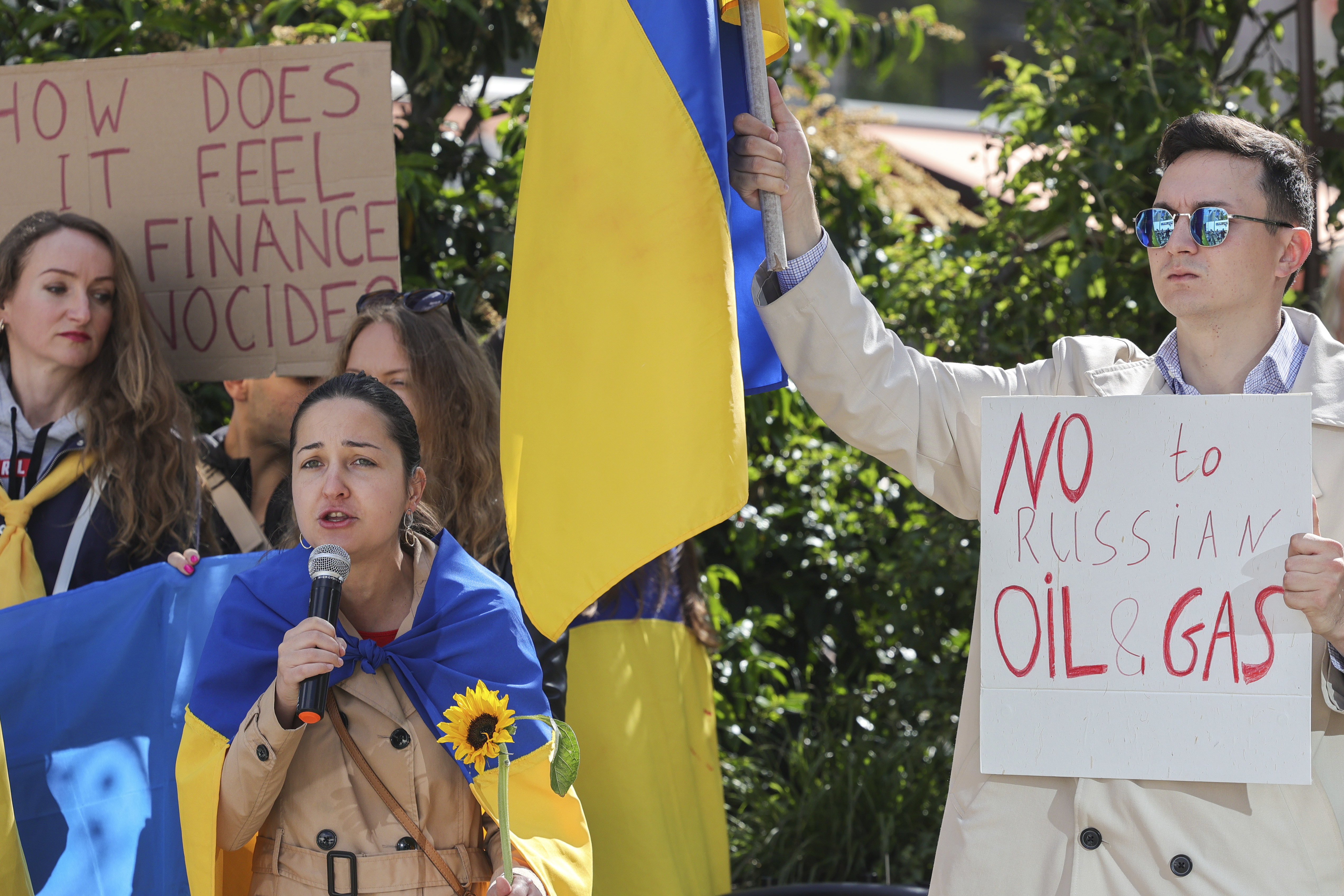Ukrainian demonstrators demand an embargo on Russian oil during a protest in front of EU institutions prior to an extraordinary meeting of EU leaders to discuss Ukraine, energy and food security at the Europa building in Brussels, Monday, May 30, 2022