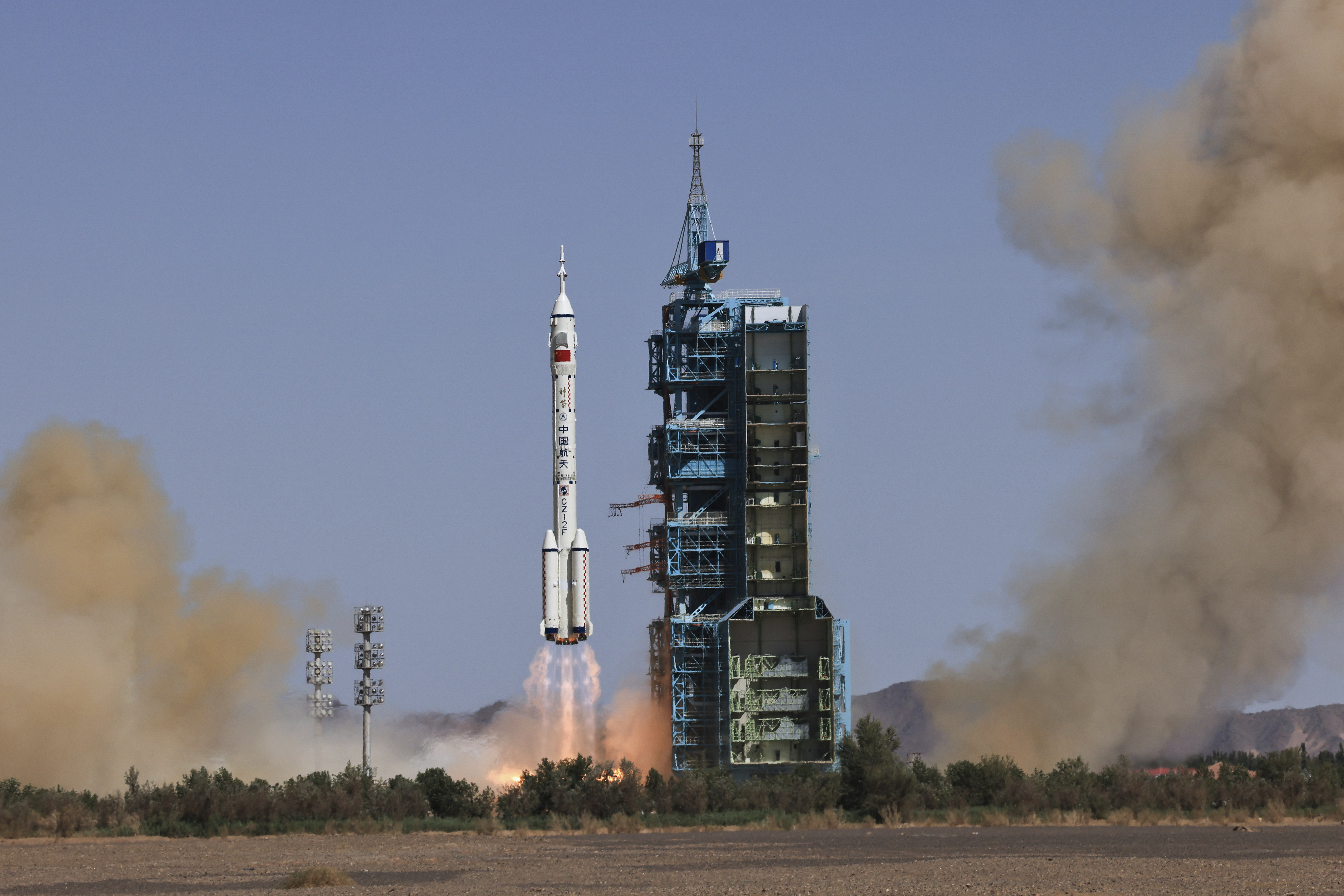 he Long March-2F carrier rocket carrying China's Shenzhou 14 spacecraft blasts off from the launch pad at the Jiuquan Satellite Launch Center in Jiuquan